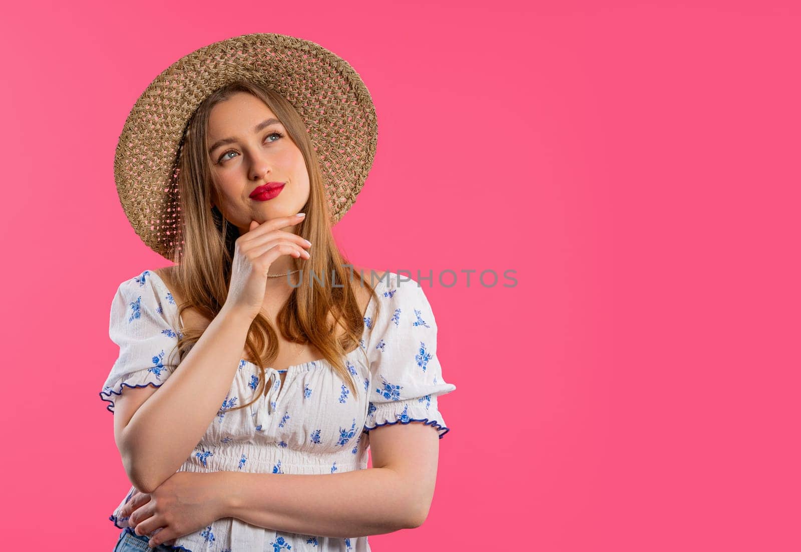 Thinking around woman on pink background. Puzzled lady looking for answer. Copy by kristina_kokhanova