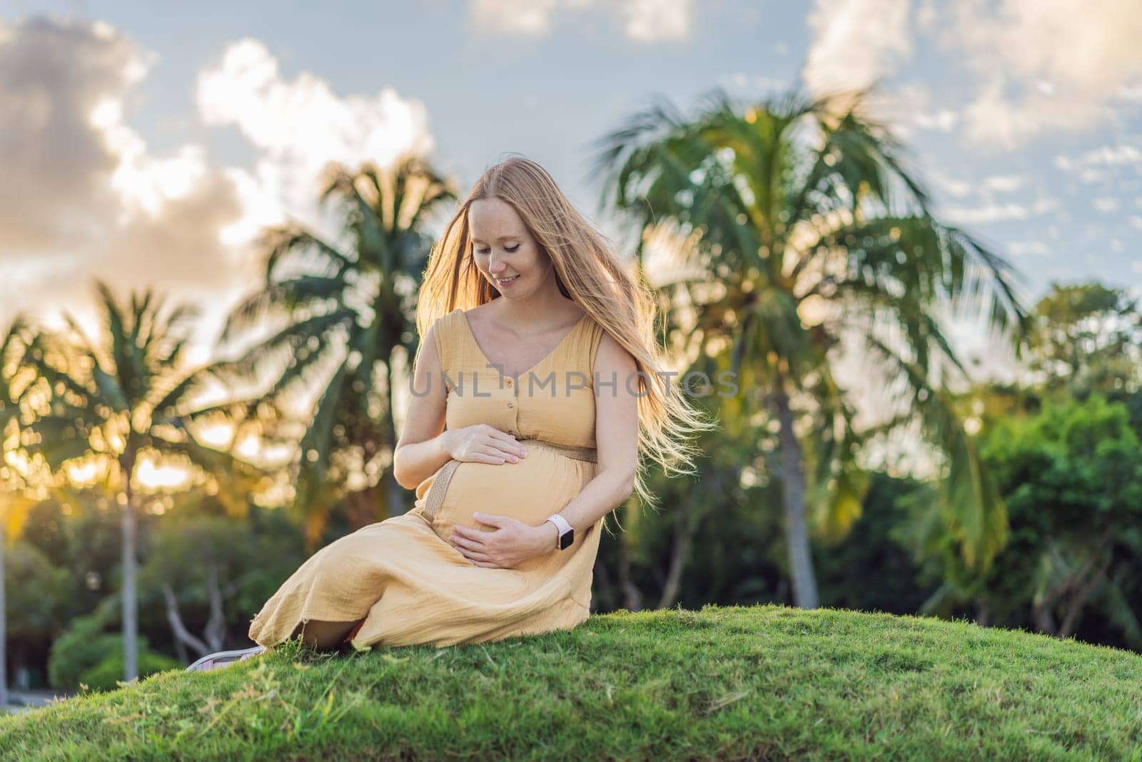 Tranquil scene as a pregnant woman enjoys peaceful moments in the park, embracing nature's serenity and finding comfort during her pregnancy by galitskaya