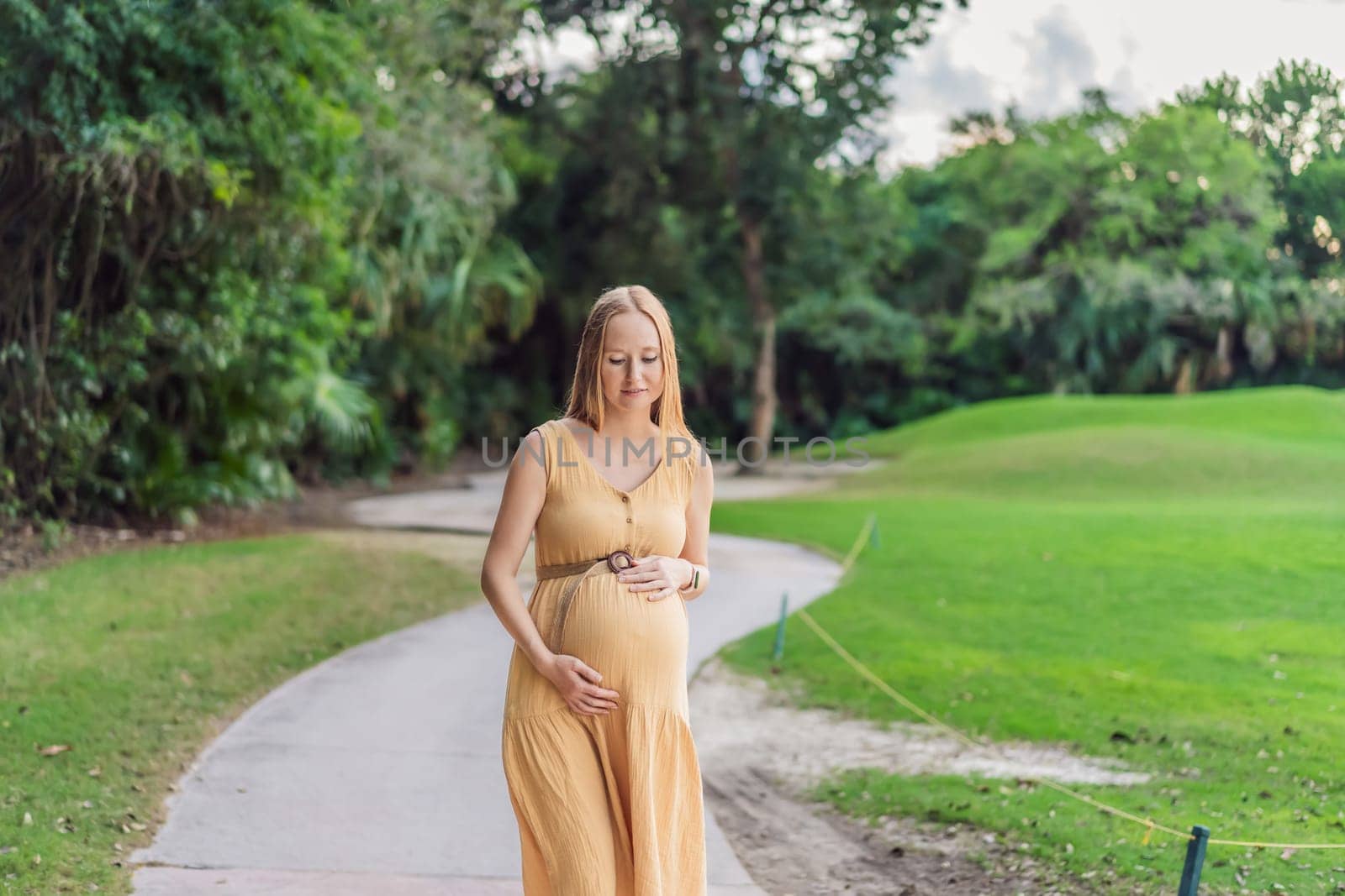 Tranquil scene as a pregnant woman enjoys peaceful moments in the park, embracing nature's serenity and finding comfort during her pregnancy.