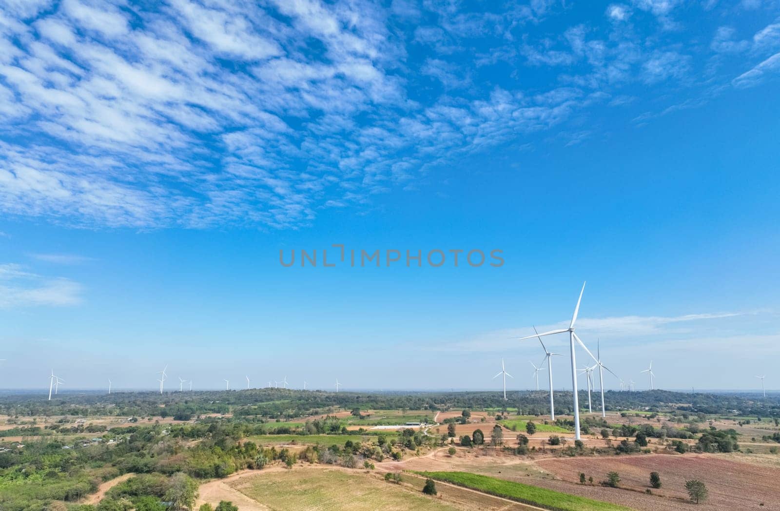 Landscape of wind farm. Wind energy. Wind power. Sustainable, renewable energy. Wind turbines generate electricity. Sustainable development. Green technology for energy sustainability. Green energy. by Fahroni