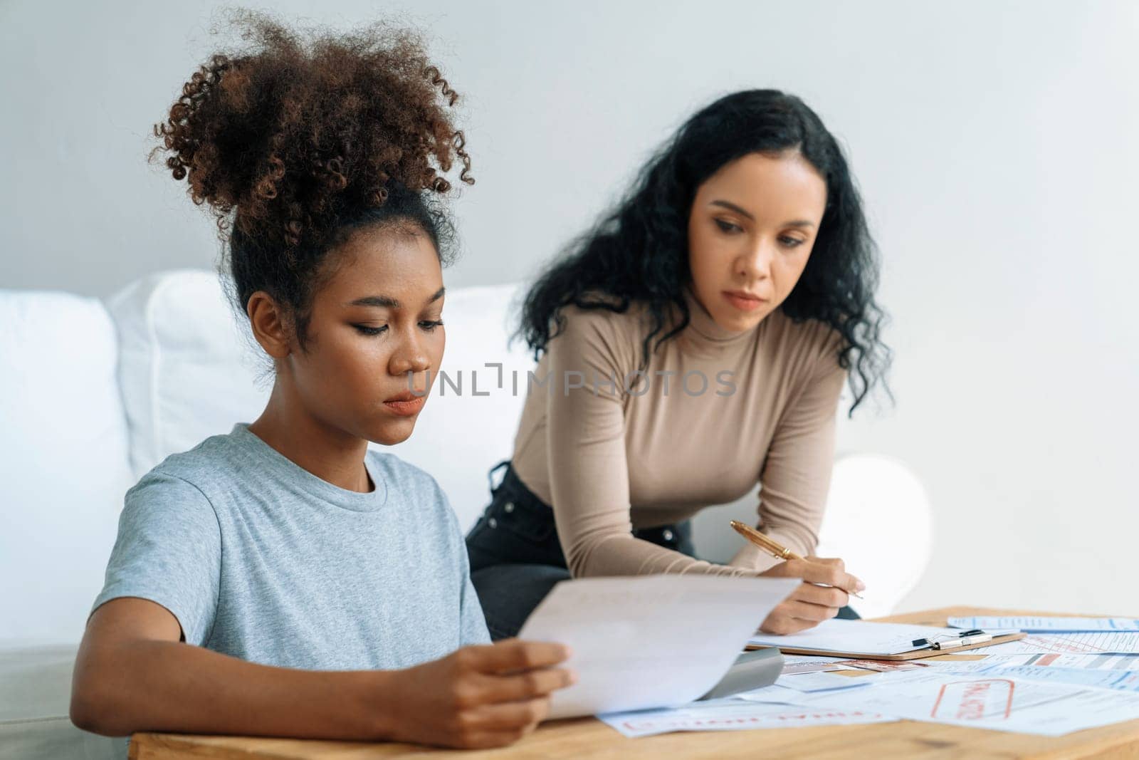 Stressed African American women has financial problems with credit card debt to pay crucial show concept of bad personal money and mortgage pay management crisis.