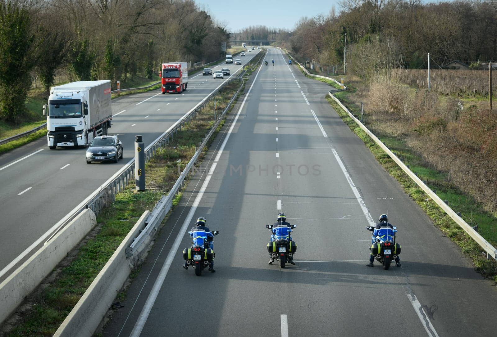 France, Bordeaux, 29 January 2024, Farmers' demonstration, mobile gendarmes on their motorbikes securing a demonstration by French farmers on a motorway in south-west France. High quality 4k footage