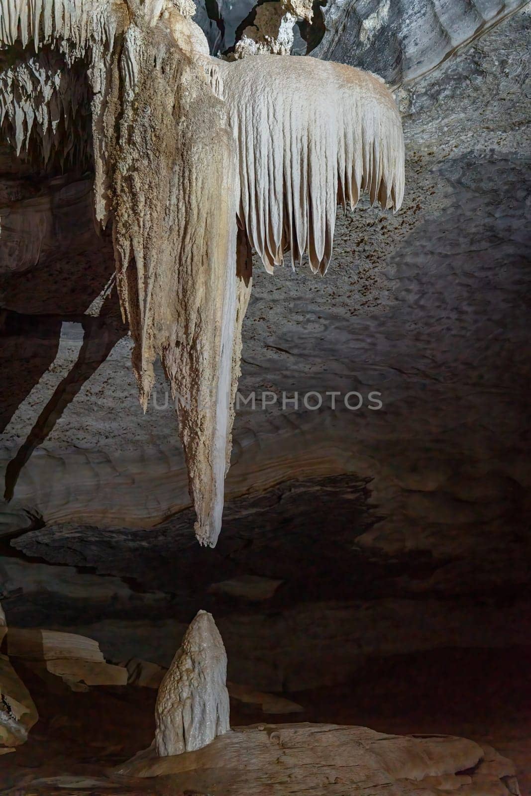 Majestic Stalactite and Stalagmite Formation in a Cave by FerradalFCG