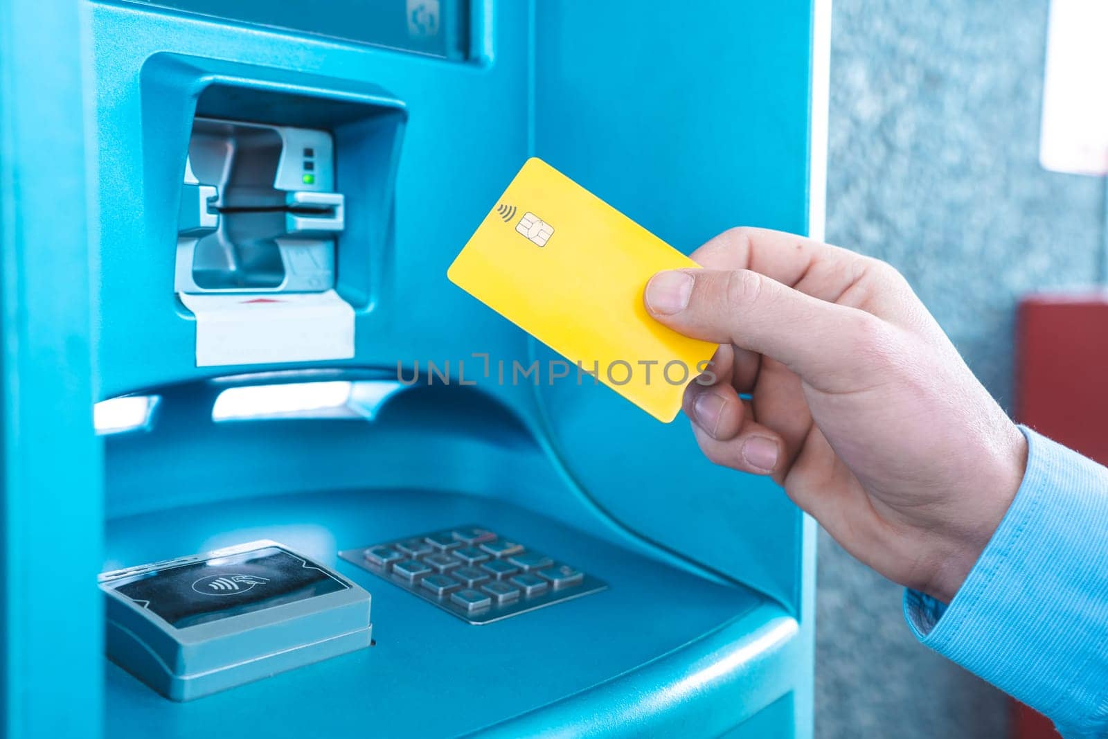 Man paying on petrol station using credit card. by PaulCarr