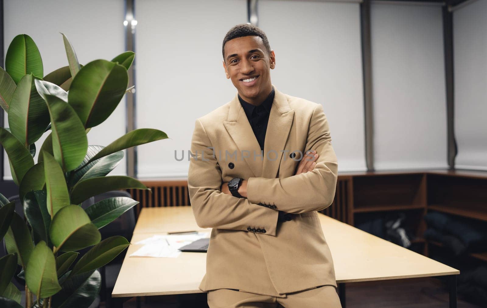 Successful african american manager inside office at workplace. High quality photo