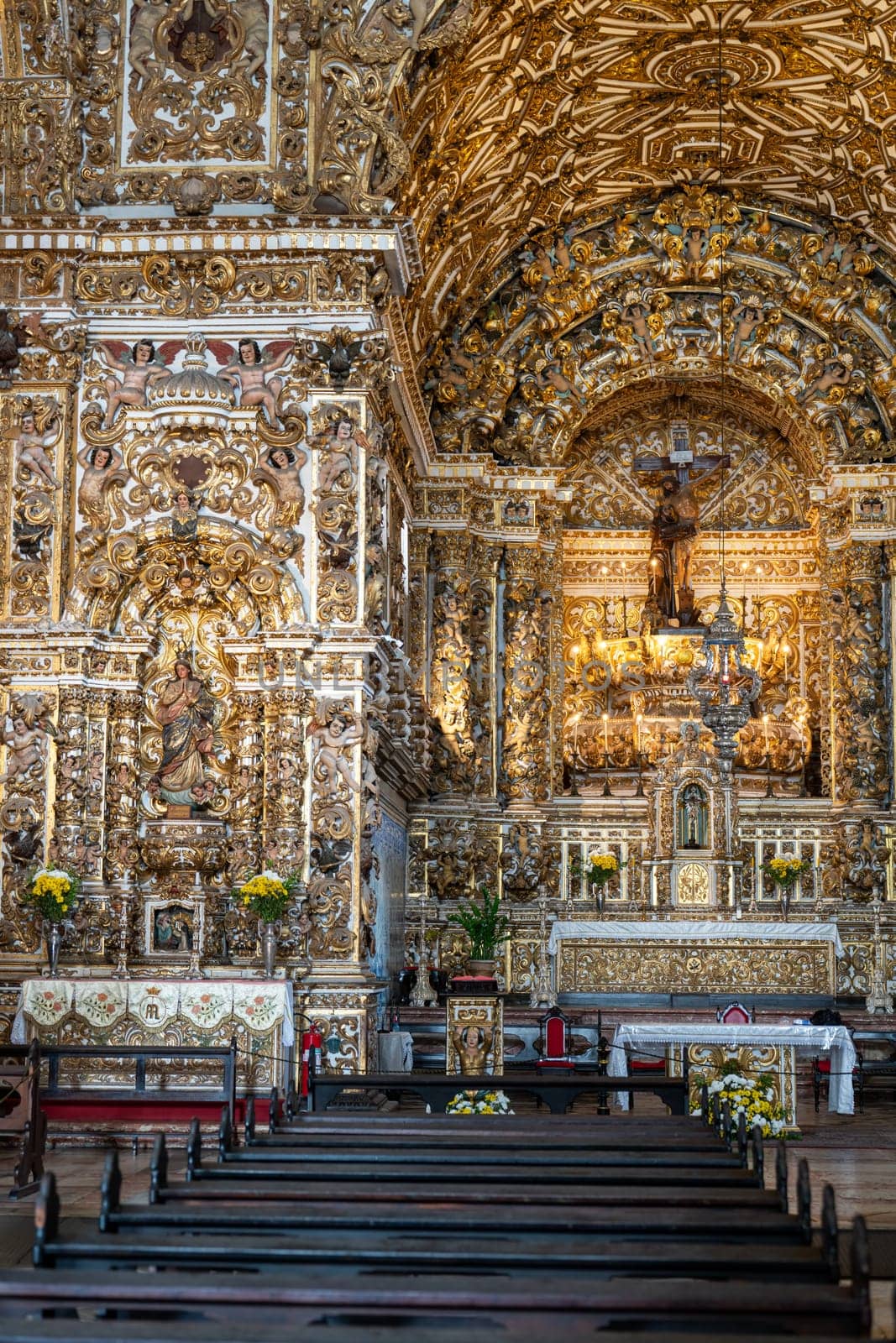 Baroque altar with gold leaf and wood carvings in a historic church.