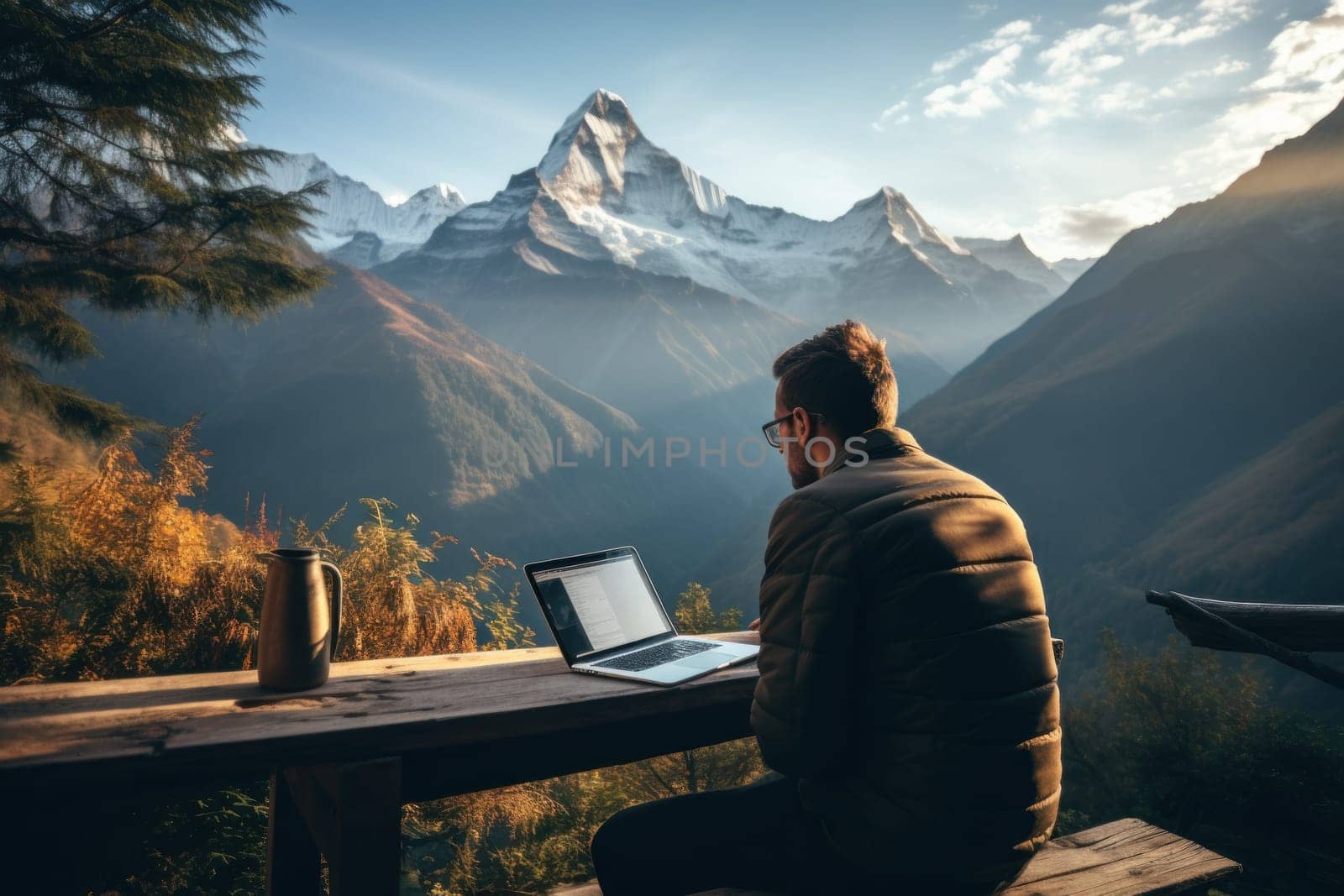 Digital nomad working on a laptop with a breathtaking mountain view. Generative AI.