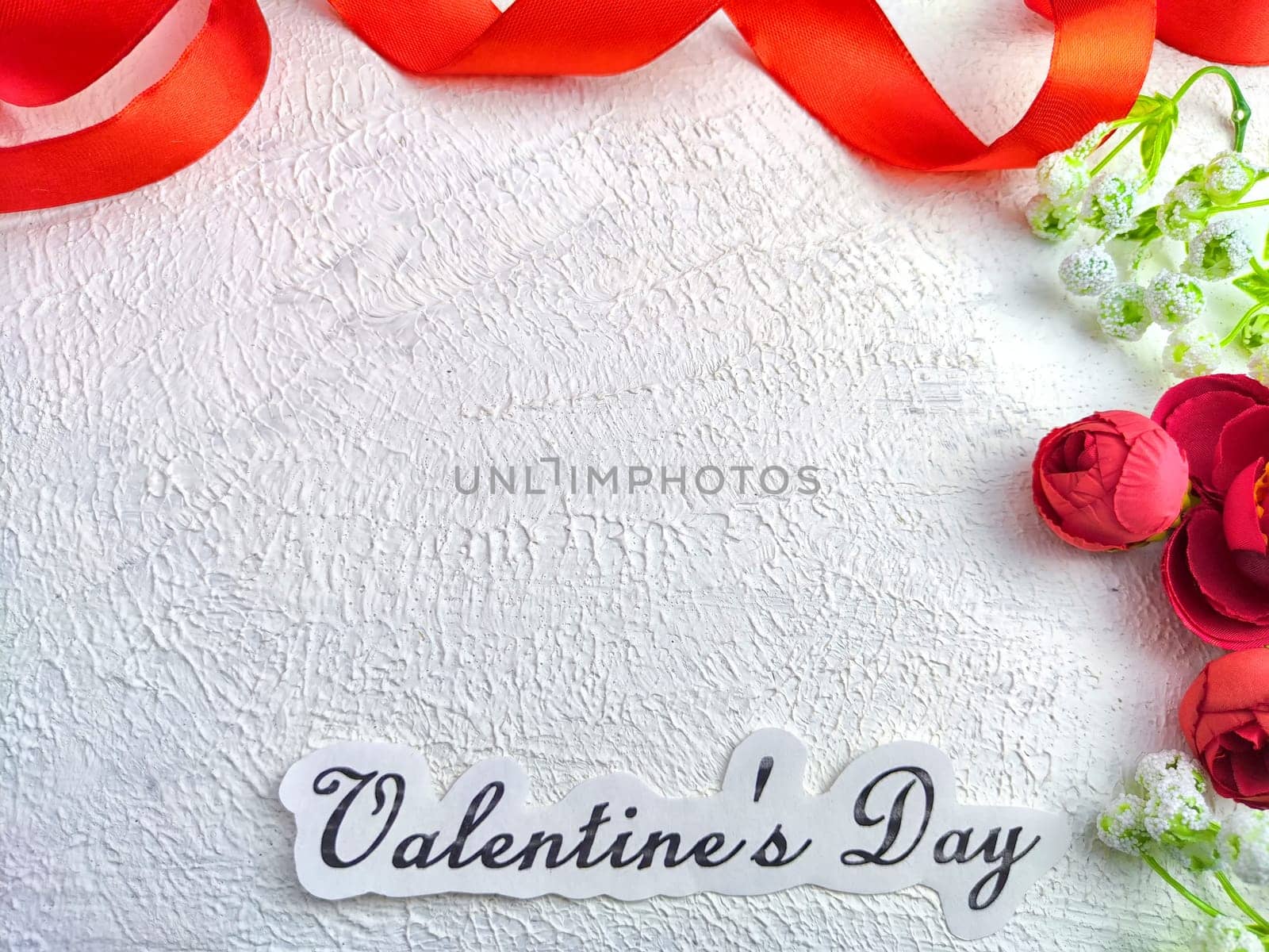 White background, flowers, red ribbon and Valentine's Day inscription. Concept of holiday. Card, Background, Texture, Frame, copy space, place for text