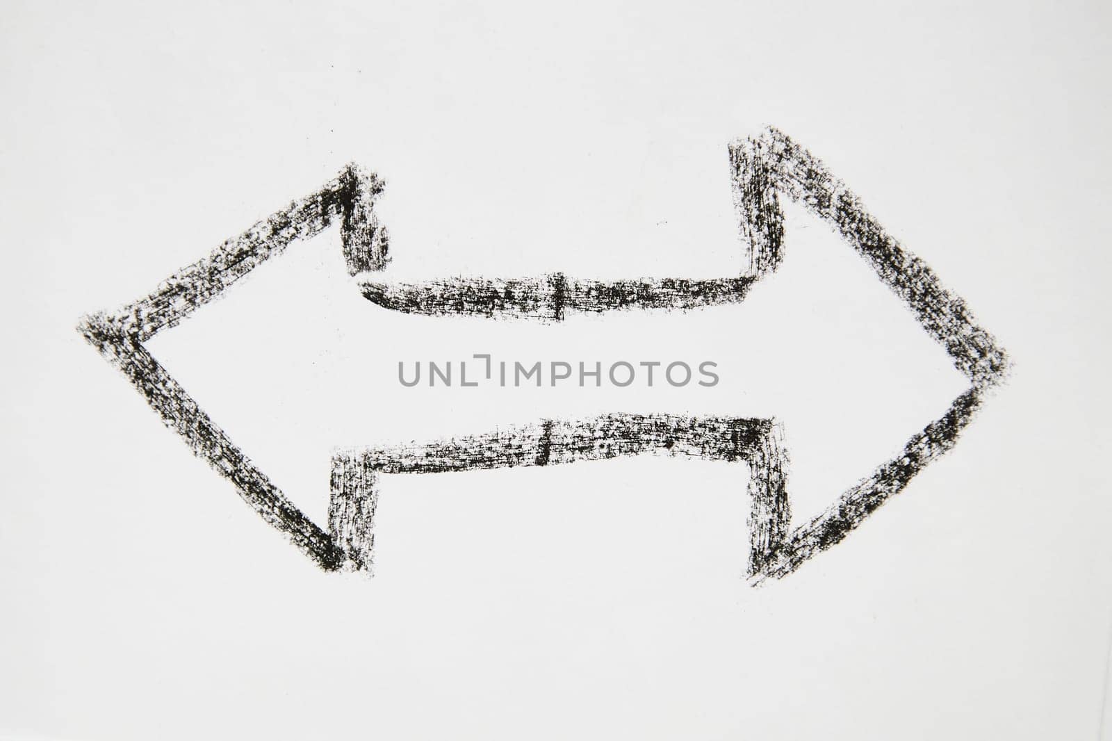 Double sided Thick smooth Hand drawn black chalk arrow. Concept of business, choosing direction, moving forward. Abstract sign, background, texture. Blurred