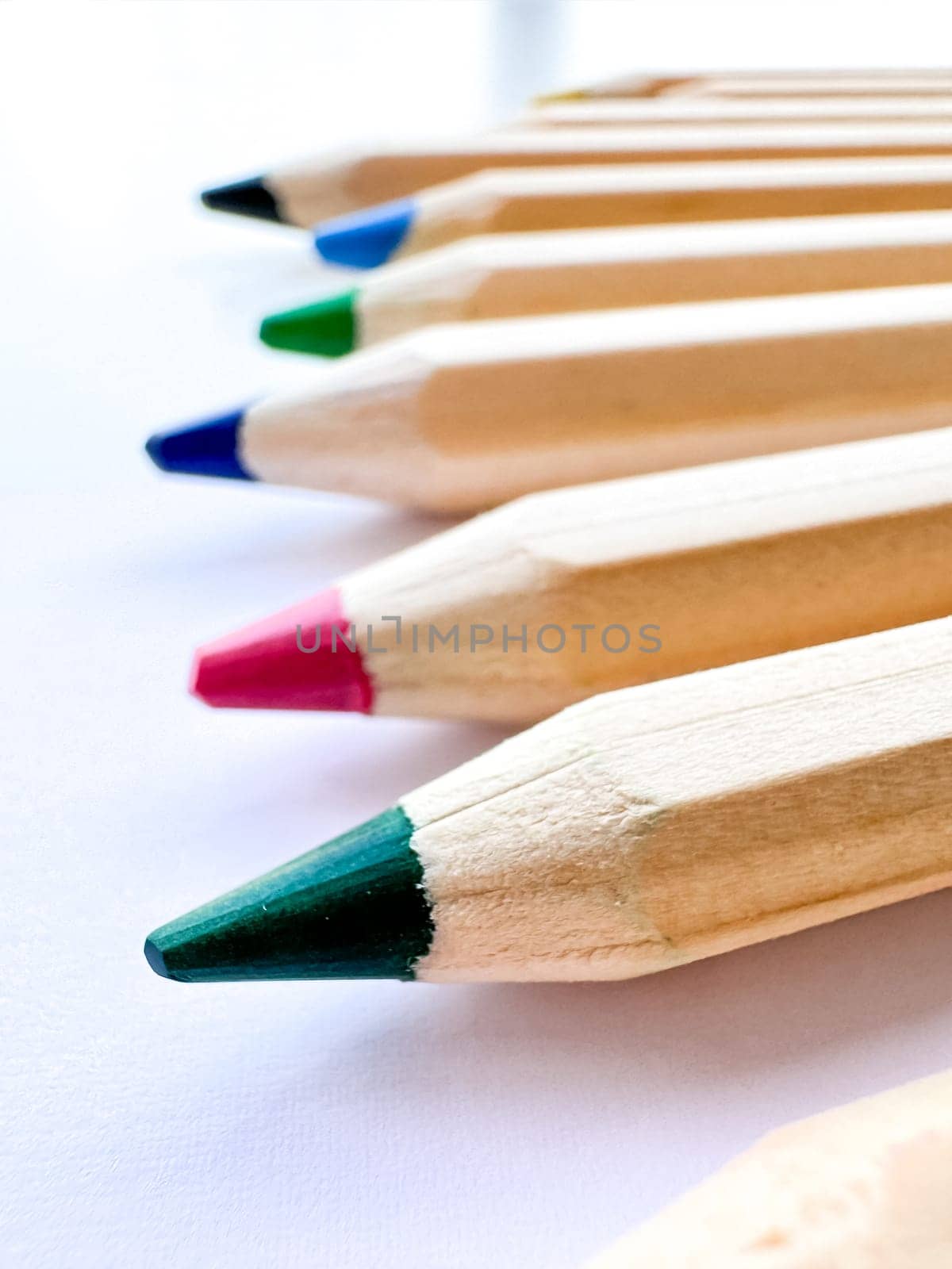 Wooden colorful ordinary pencils isolated on a white background. High quality photo