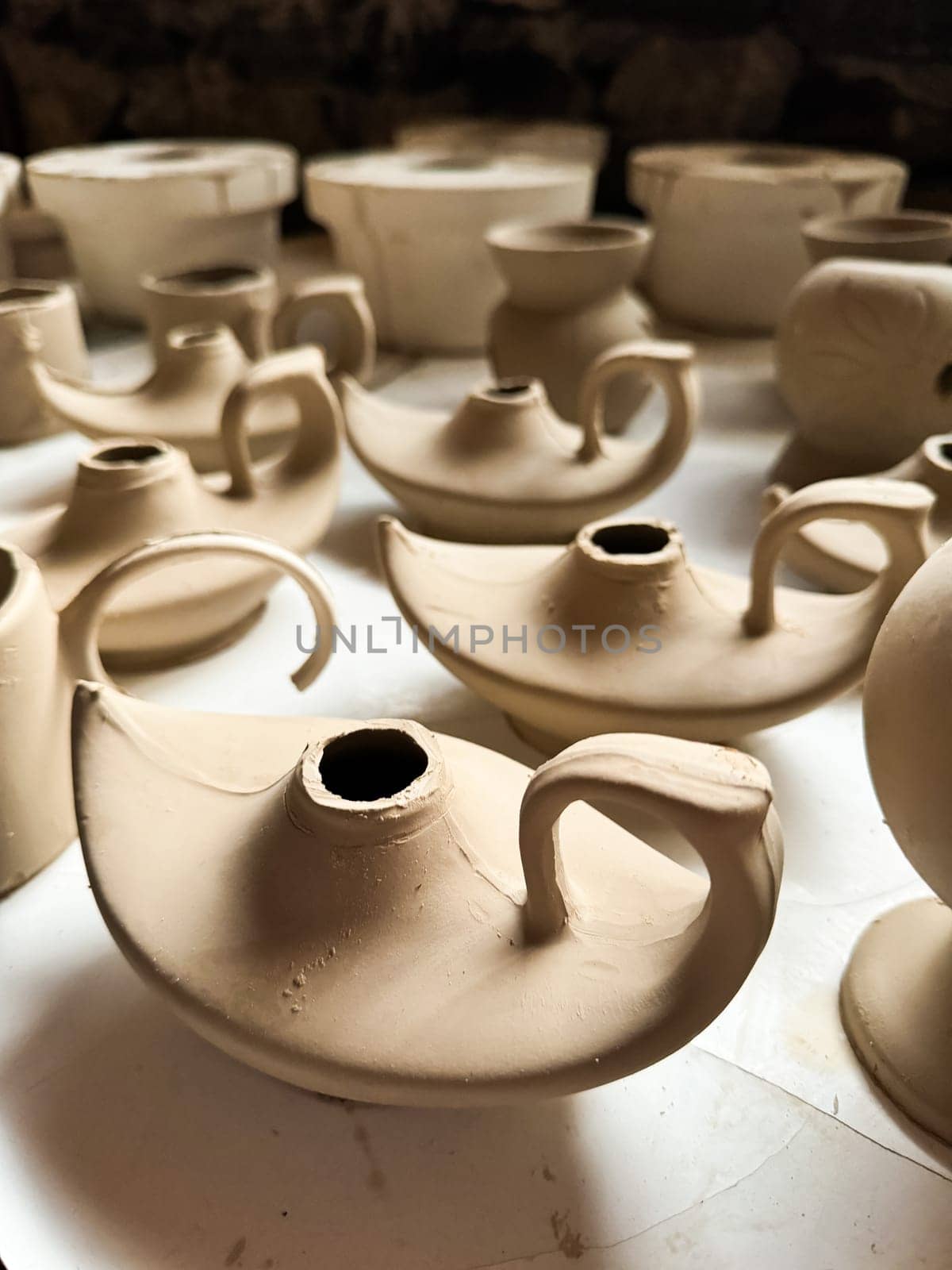 Clay blanks for a kerosene lamp in a pottery workshop. Close up photo. High quality photo