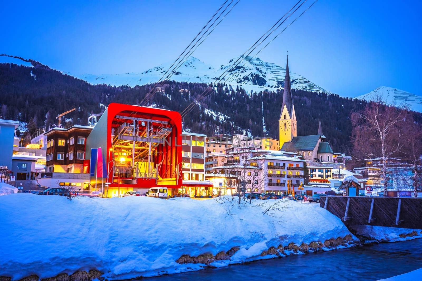 Idyllic mountain town of Davos in Swiss Alps evening view by xbrchx