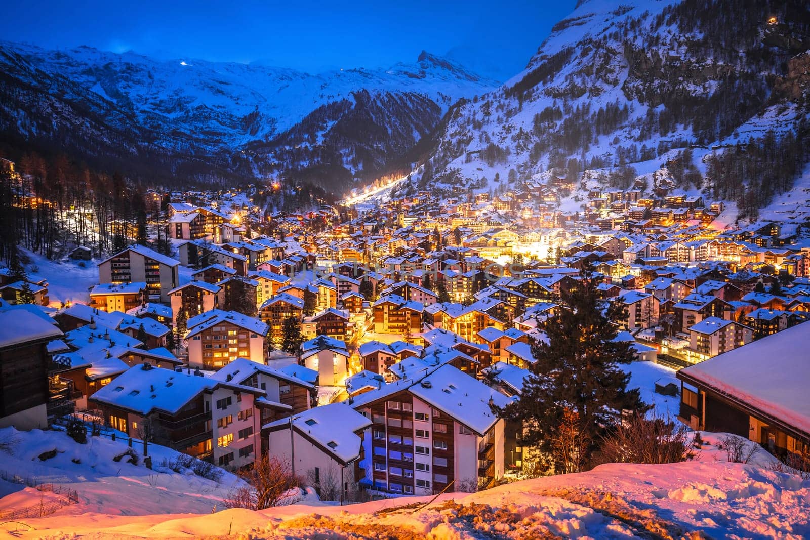 Idyllic village of Zermatt rooftops evening view, luxury winter destination in Switzerland