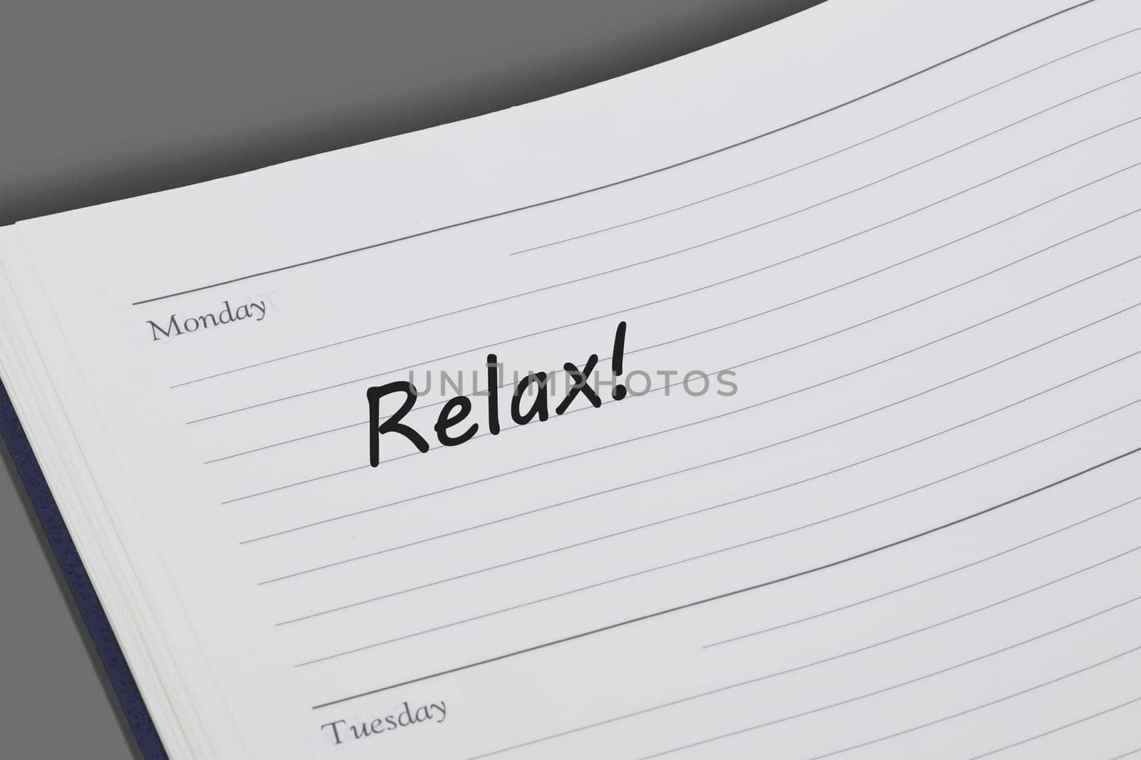Relax reminder message in an open diary by VivacityImages