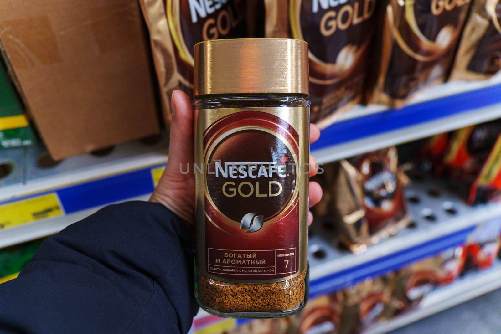 Tyumen, Russia-November 25, 2023: Nescafe Gold coffee in a glass jar. Nescafe is a brand of instant powdered coffee made by Nestle. by darksoul72