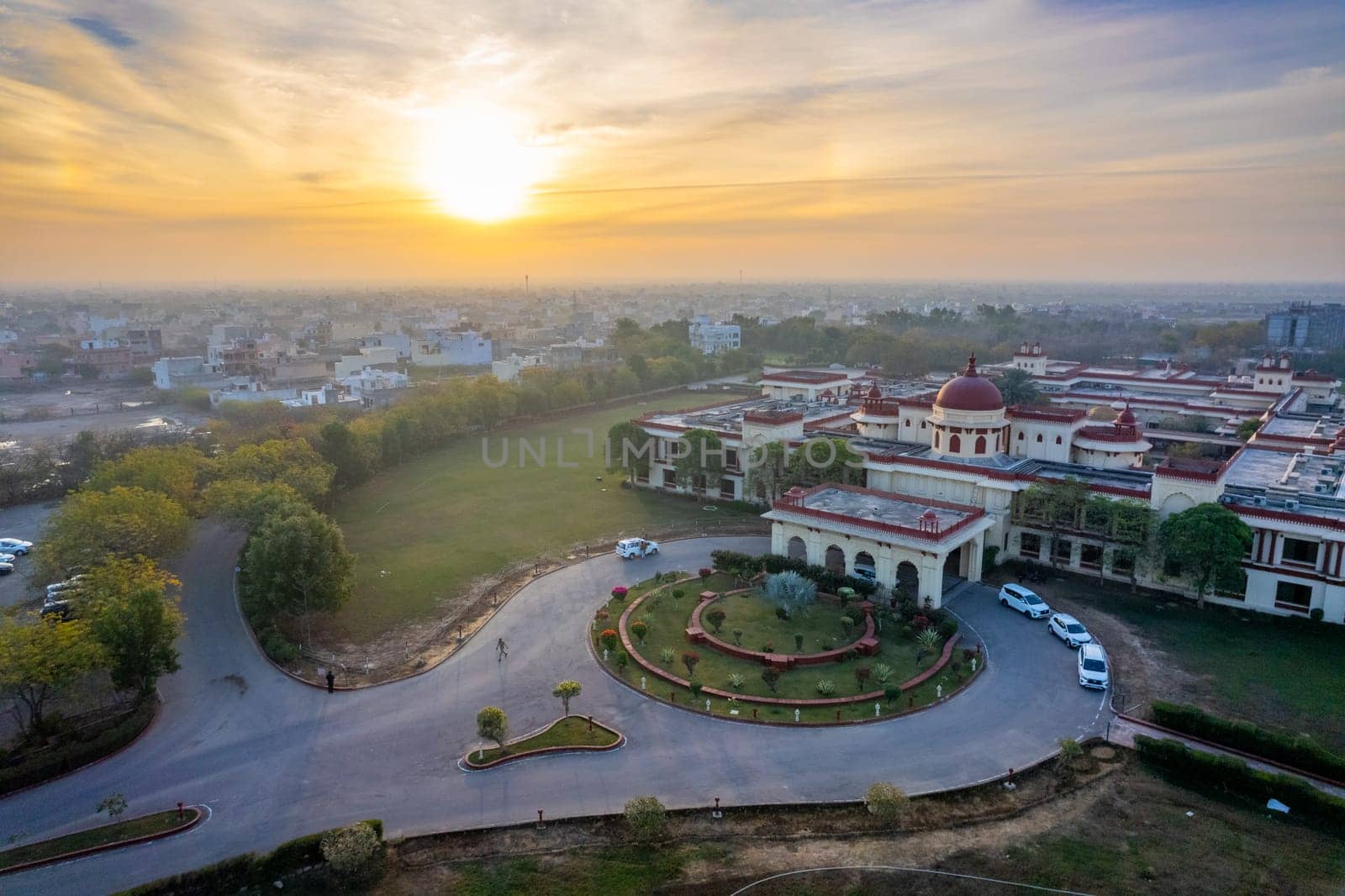 Aerial drone shot of royal palace hotel resort at sunrise showing the elegant buildings in the city of Jodhpur, Udaipur in Rajasthan in India