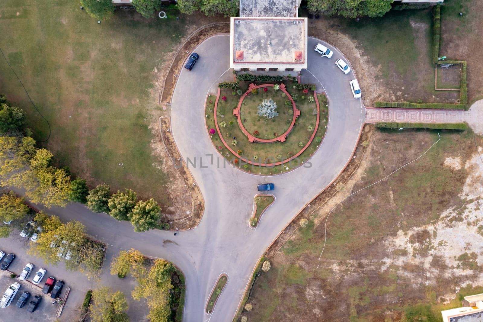 Aerial drone shot of entrance loop of royal palace hotel resort showing the elegant buildings in the city of Jodhpur, Udaipur in Rajasthan by Shalinimathur