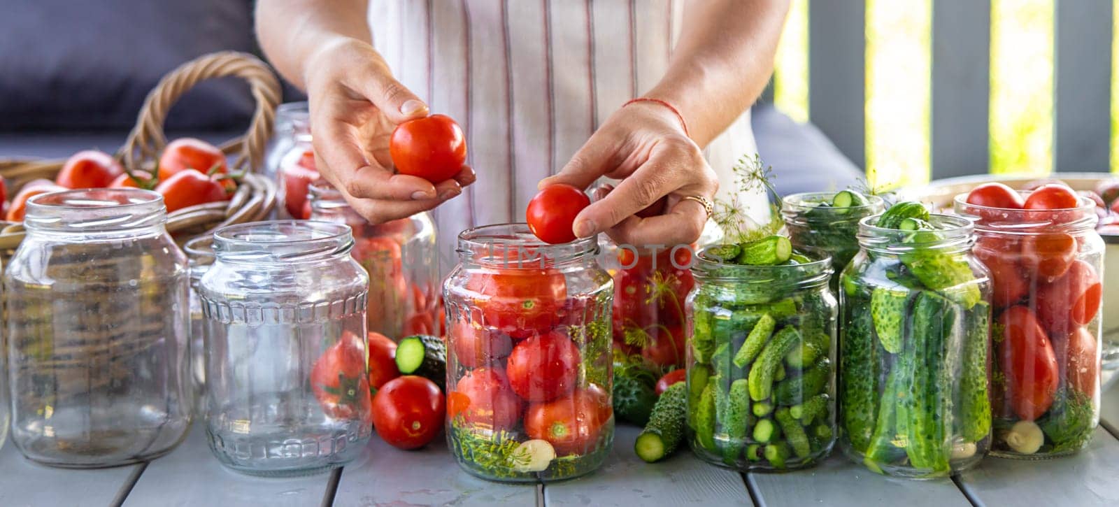 Preserving tomatoes in jars. Selective focus. Food.