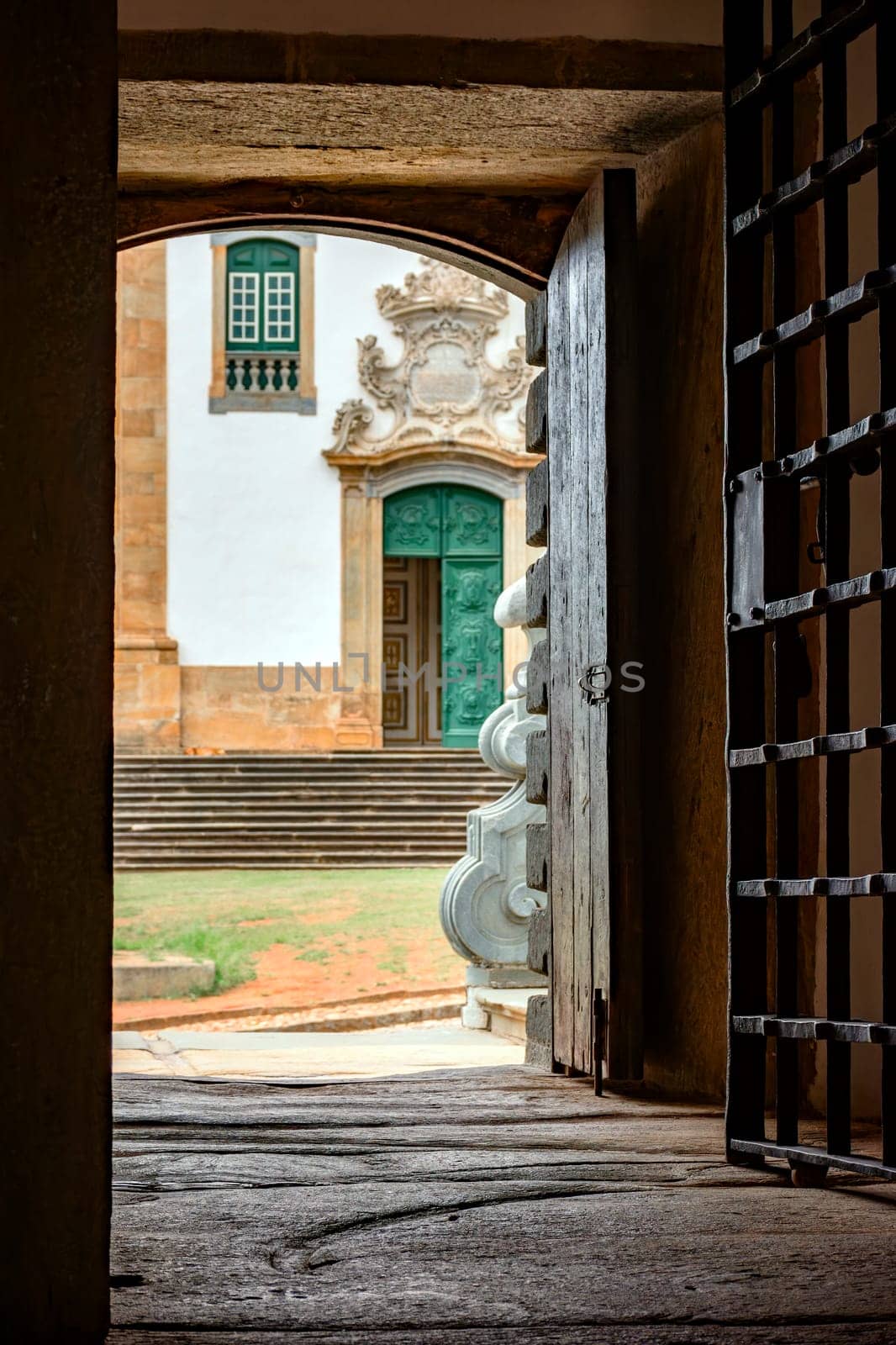 Baroque church seen from inside a historic prison by Fred_Pinheiro