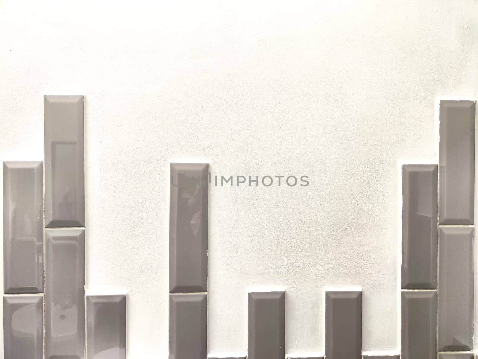 The texture is uneven teeth of gray new brick. The texture of stone wall. A piece of abstract brickwork