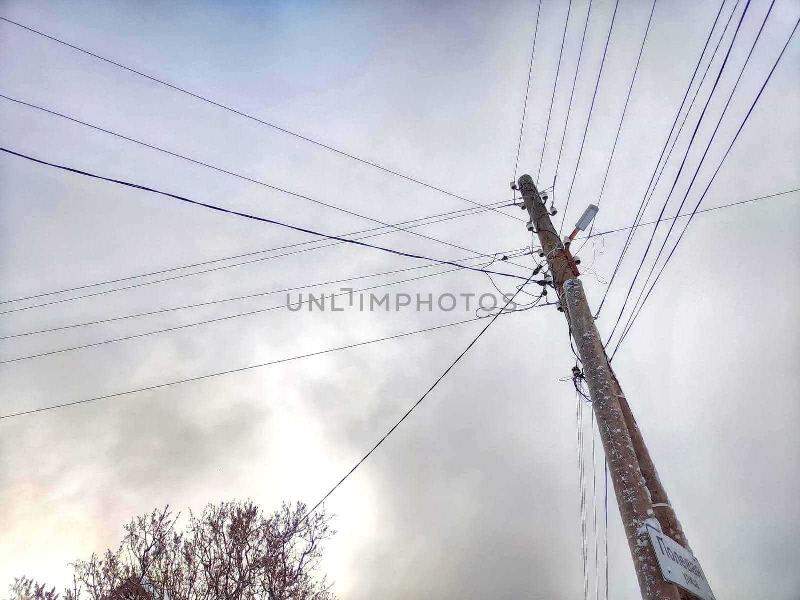 Old pole with wires against the sky. Electric transmission line, Eco-friendly energy