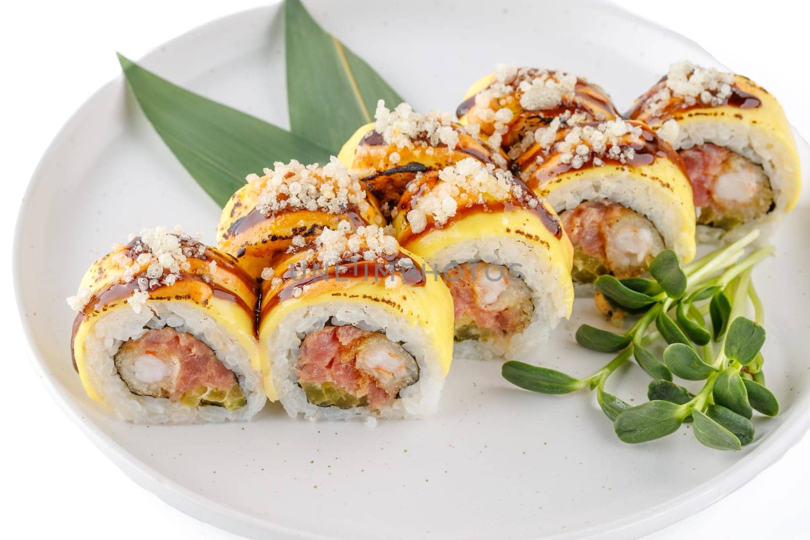 Roll with tuna tartare and tempura shrimp studio shooting on a white background