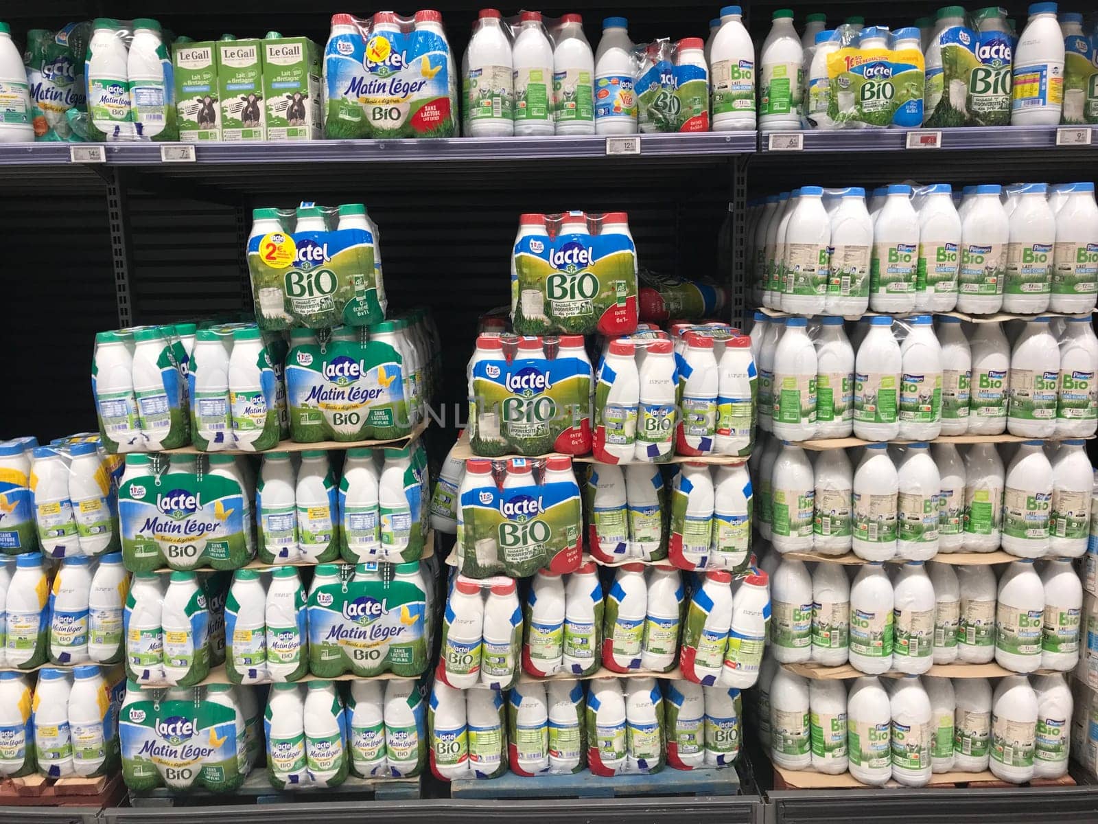 FRANCE, BORDEAUX, February, 2, 2024: Shelves with different dairy products from various manufacturers in supermarket. by FreeProd