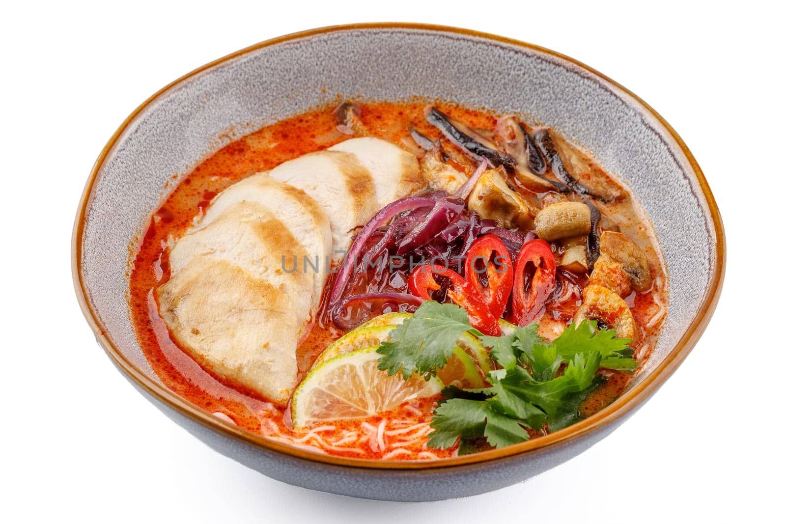 Tom Yam with chicken on a white background studio food photo