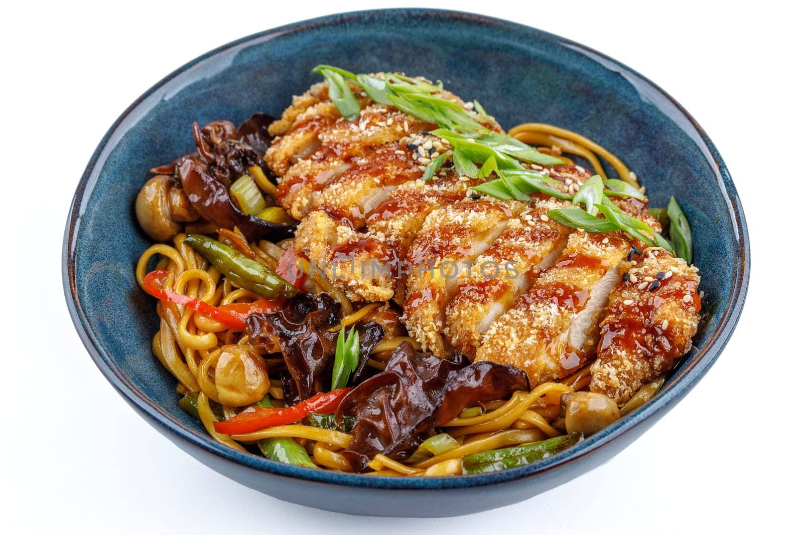 Udon with chicken schnitzel on a white background studio shooting
