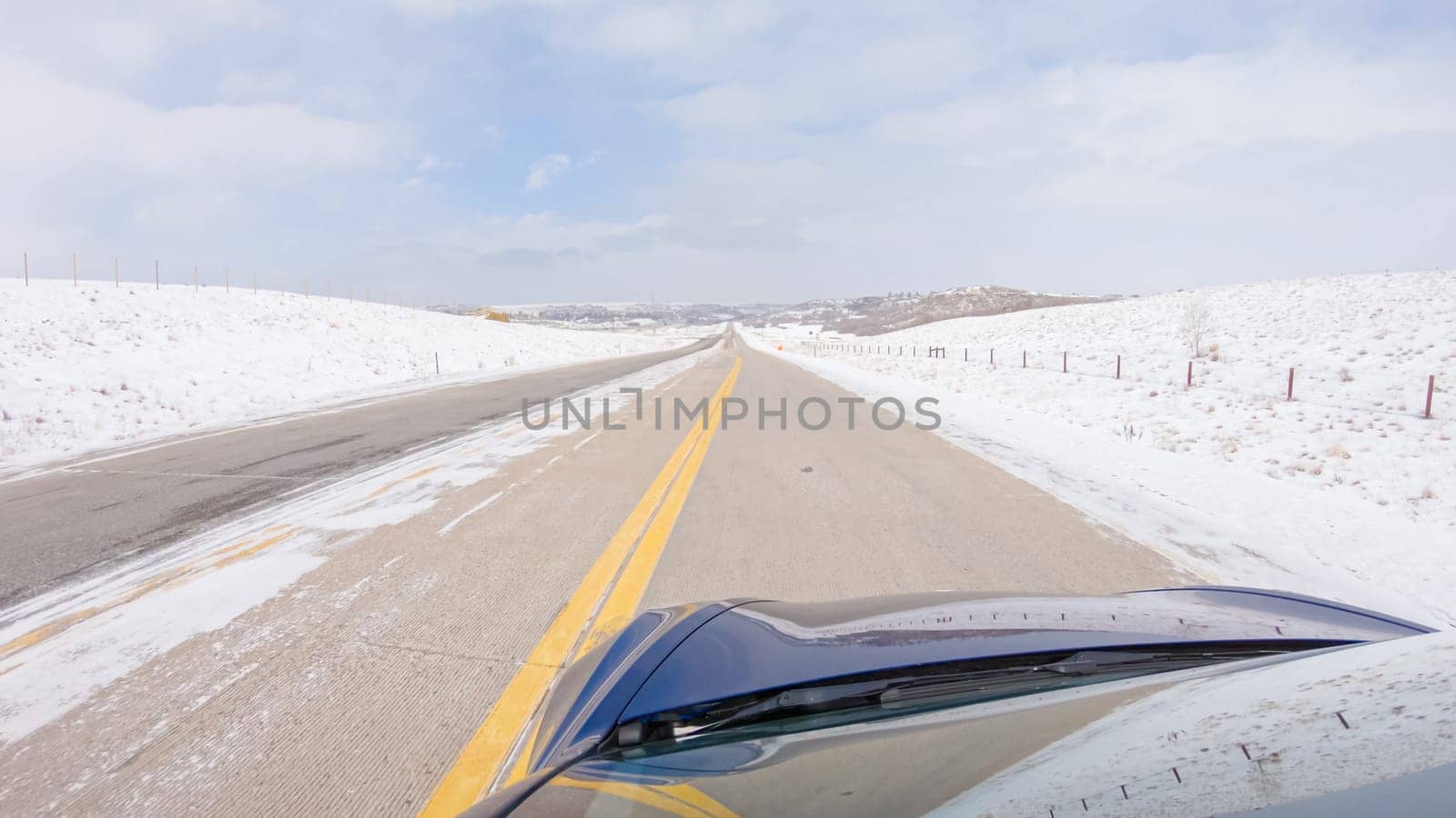 Driving on Suburban Road Post-Winter Storm by arinahabich