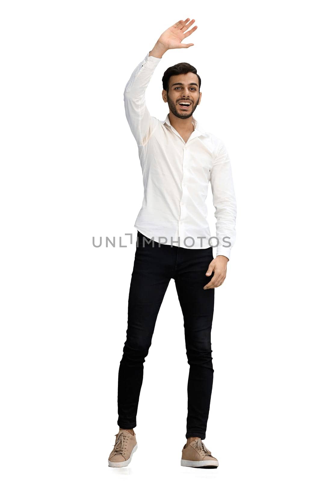 a full-length man on a white background waves hello.