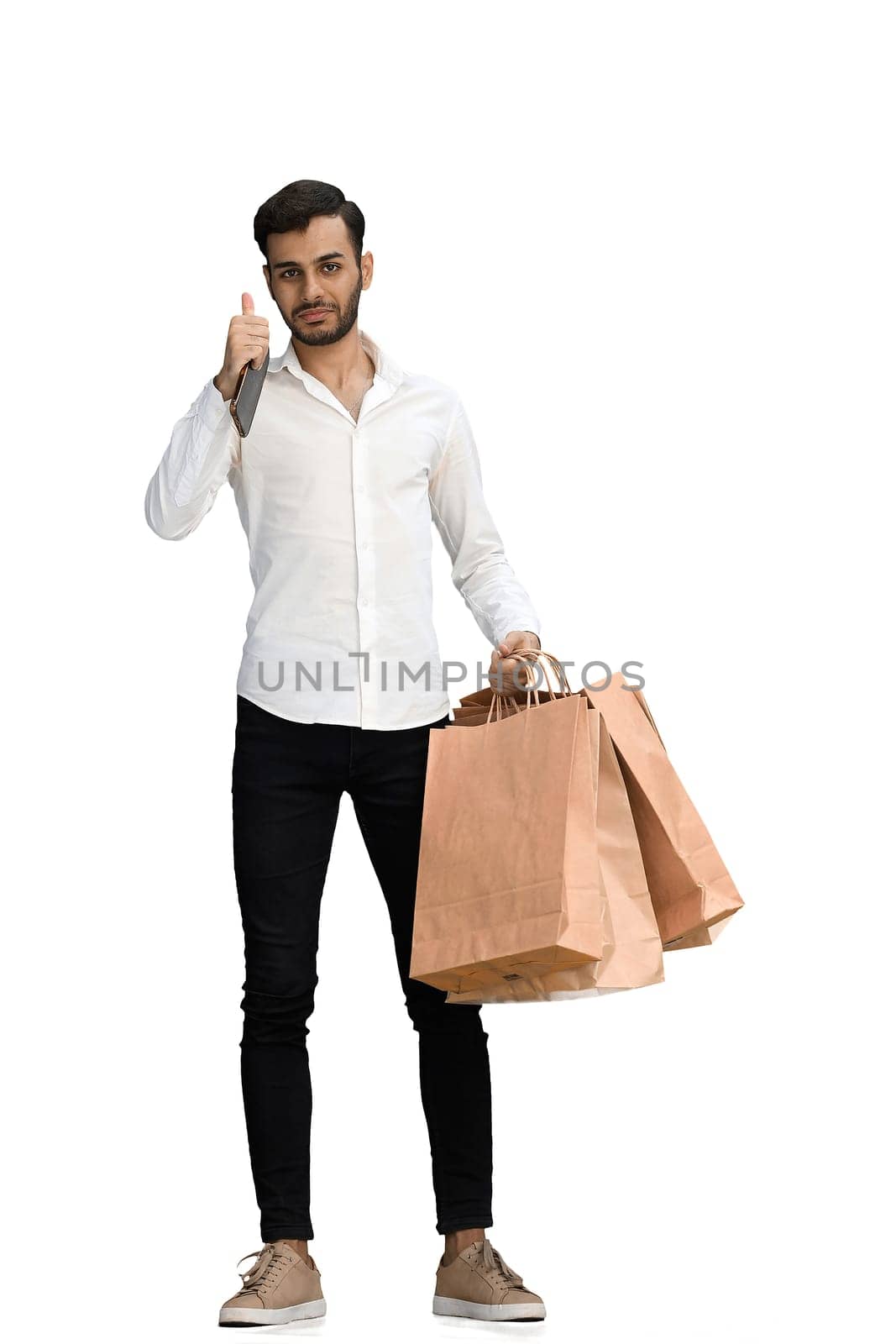 Man on a white background with shoppers show thumb up.