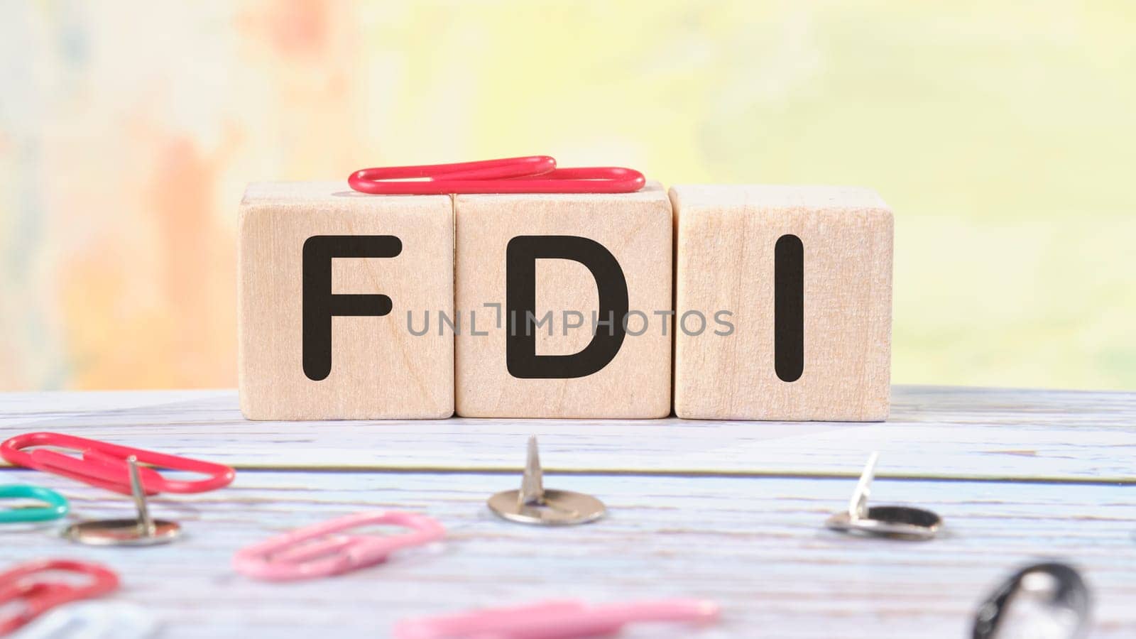 Word FDI written on wooden cubes stock image.