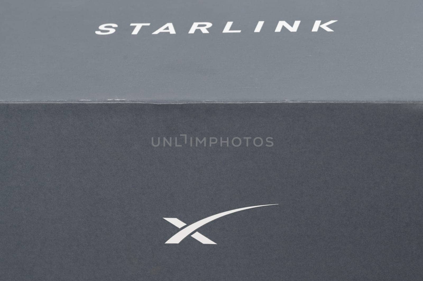 Ivano-Frankivsk, Ukraine December 2, 2023: Starlink antenna box with logo. by Niko_Cingaryuk