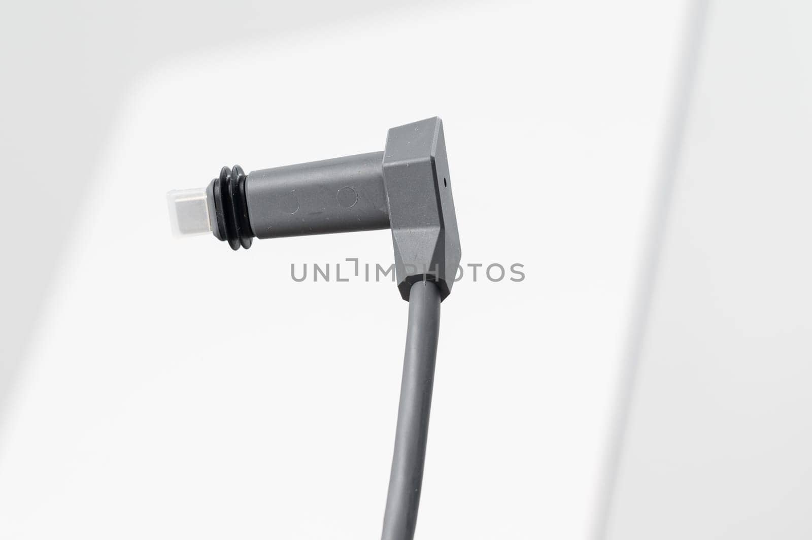 Ivano-Frankivsk, Ukraine December 2, 2023: adapter cable for Starlink satellite antenna on a white background.