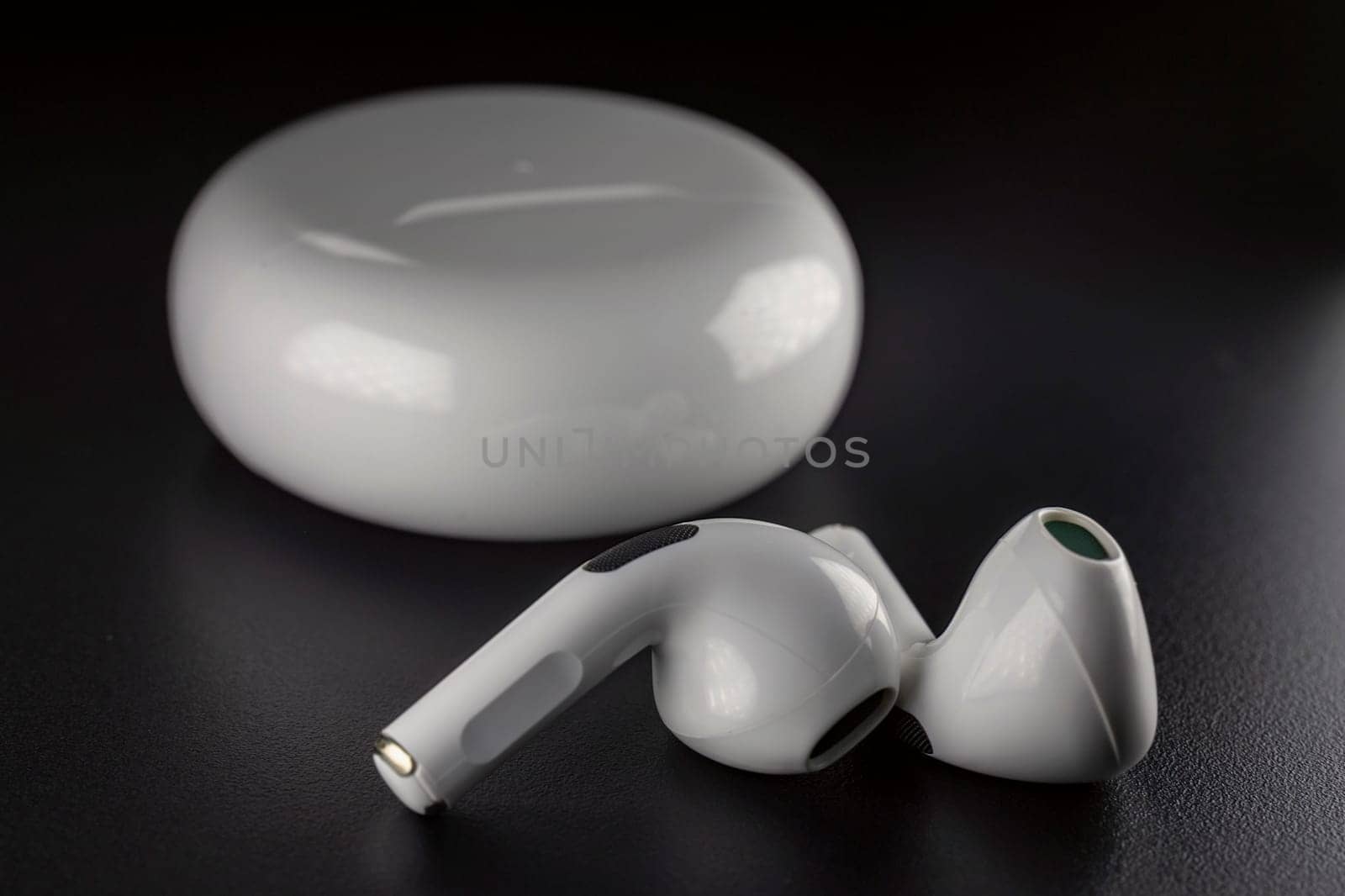 ROSTOV-ON-DON, RUSSIA - APRIL 28, 2018: Apple AirPods wireless Bluetooth headphones and charging case for Apple iPhone. New Apple Earpods Airpods in box.