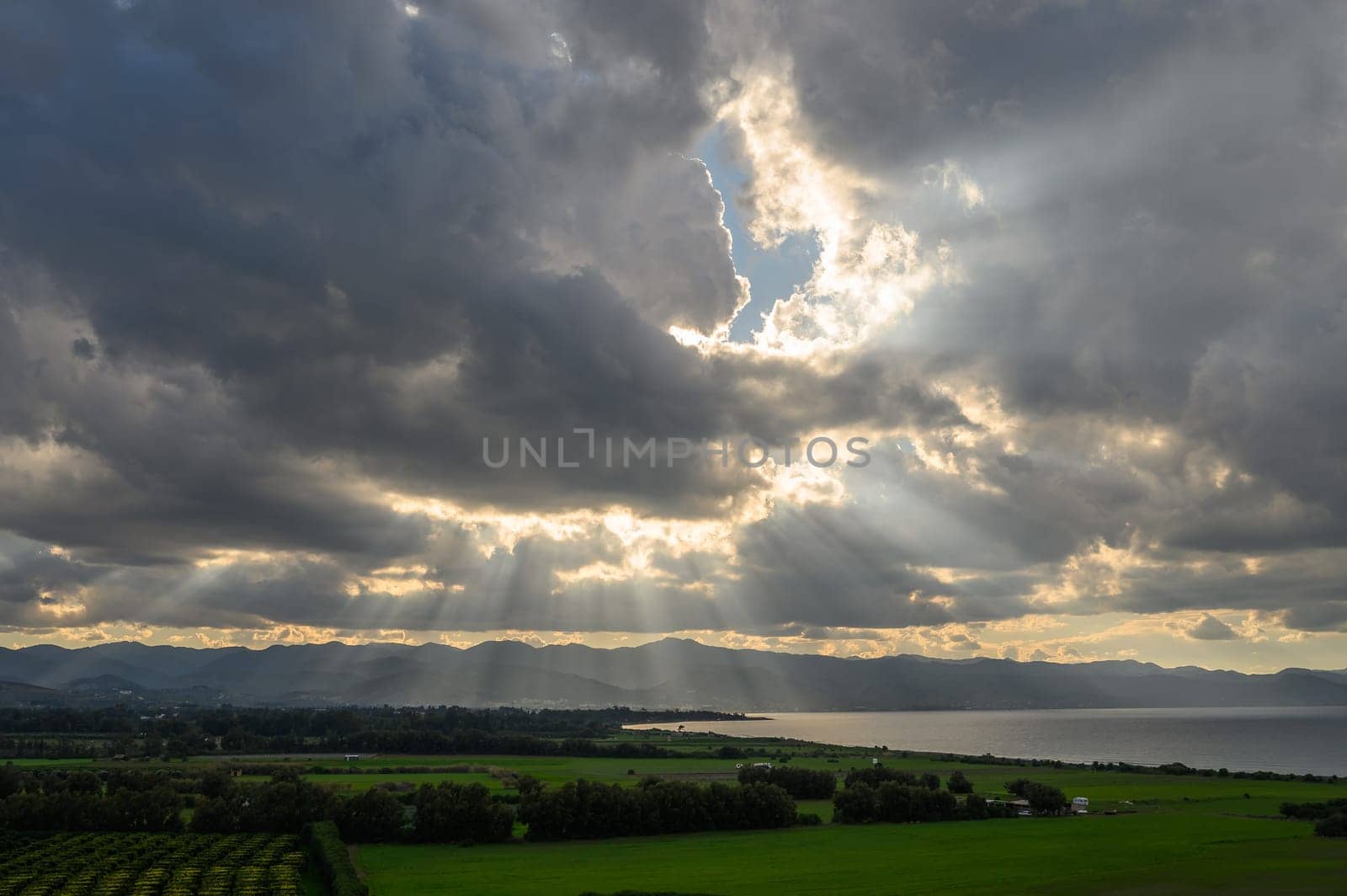 clouds and sun rays over the Mediterranean sea and mountains in winter in Cyprus 2