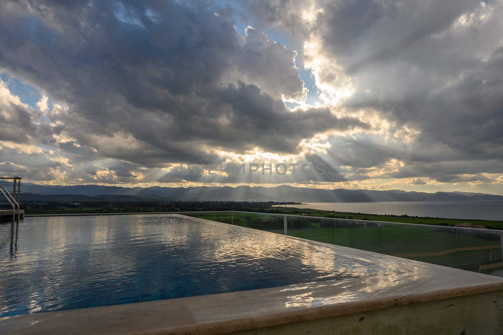 clouds and sun rays over the Mediterranean sea and mountains in winter in Cyprus 1