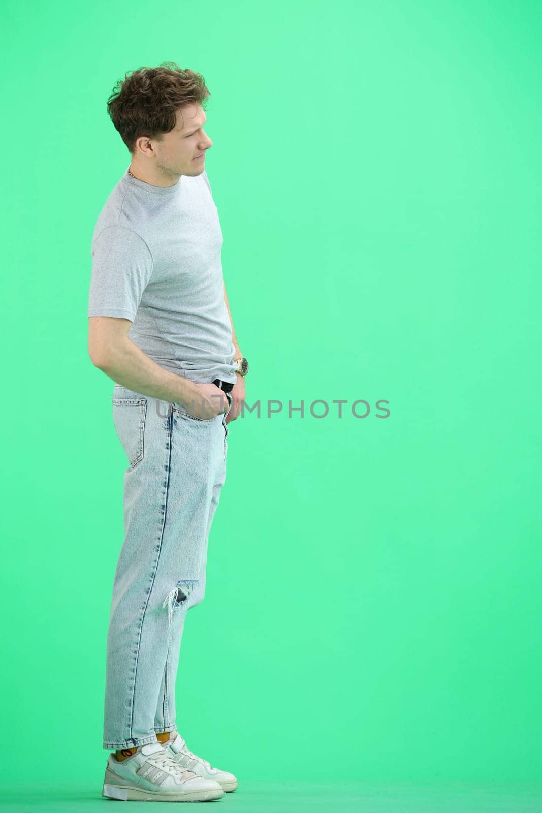 A man, full-length, on a green background by Prosto