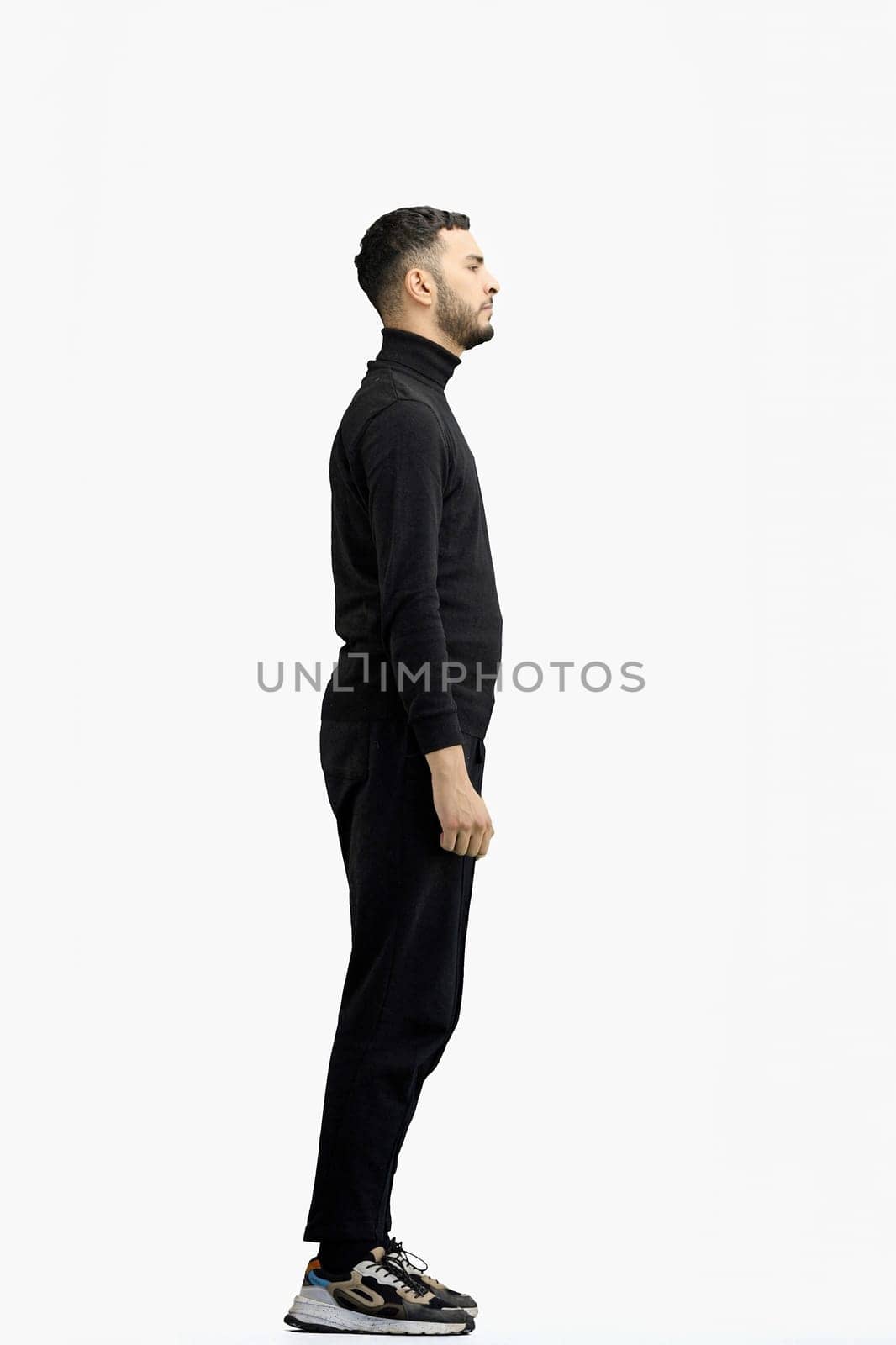 A man, full-length, on a white background.