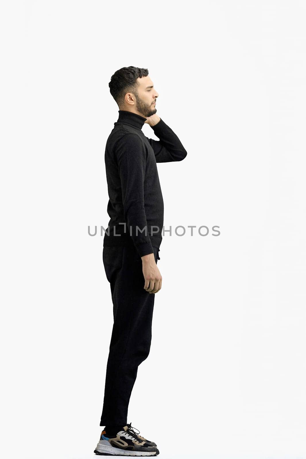 A man, full-length, on a white background, tired.