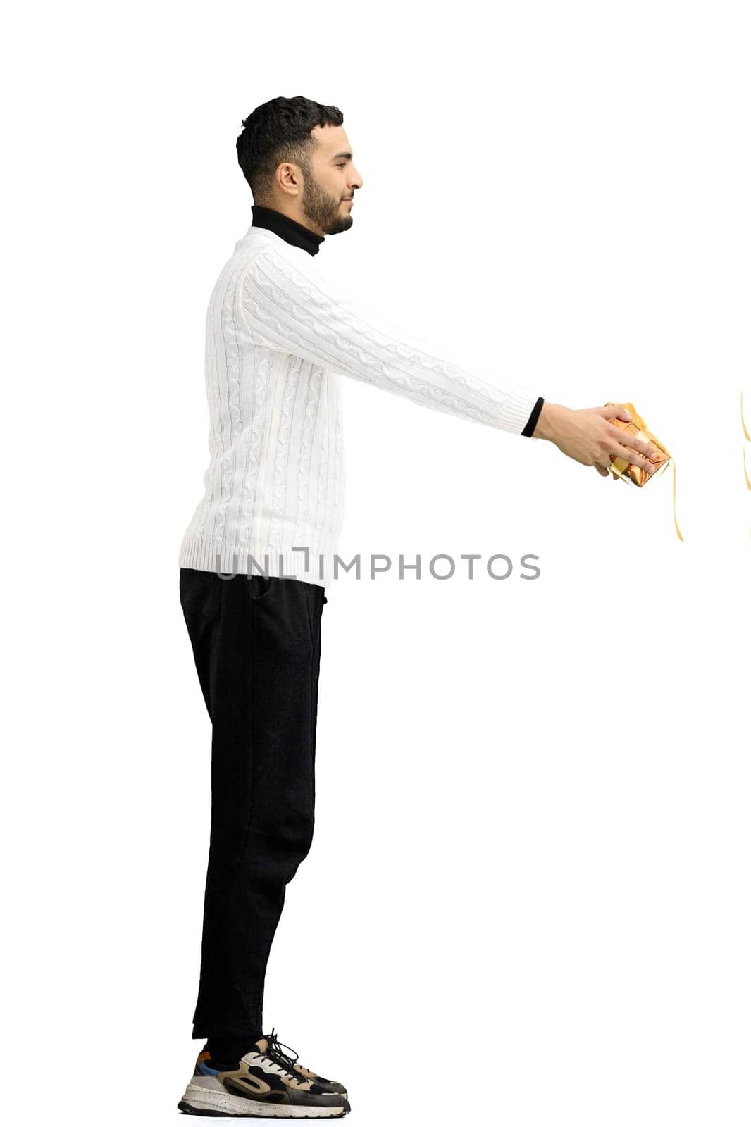 A man, full-length, on a white background, with a gift by Prosto