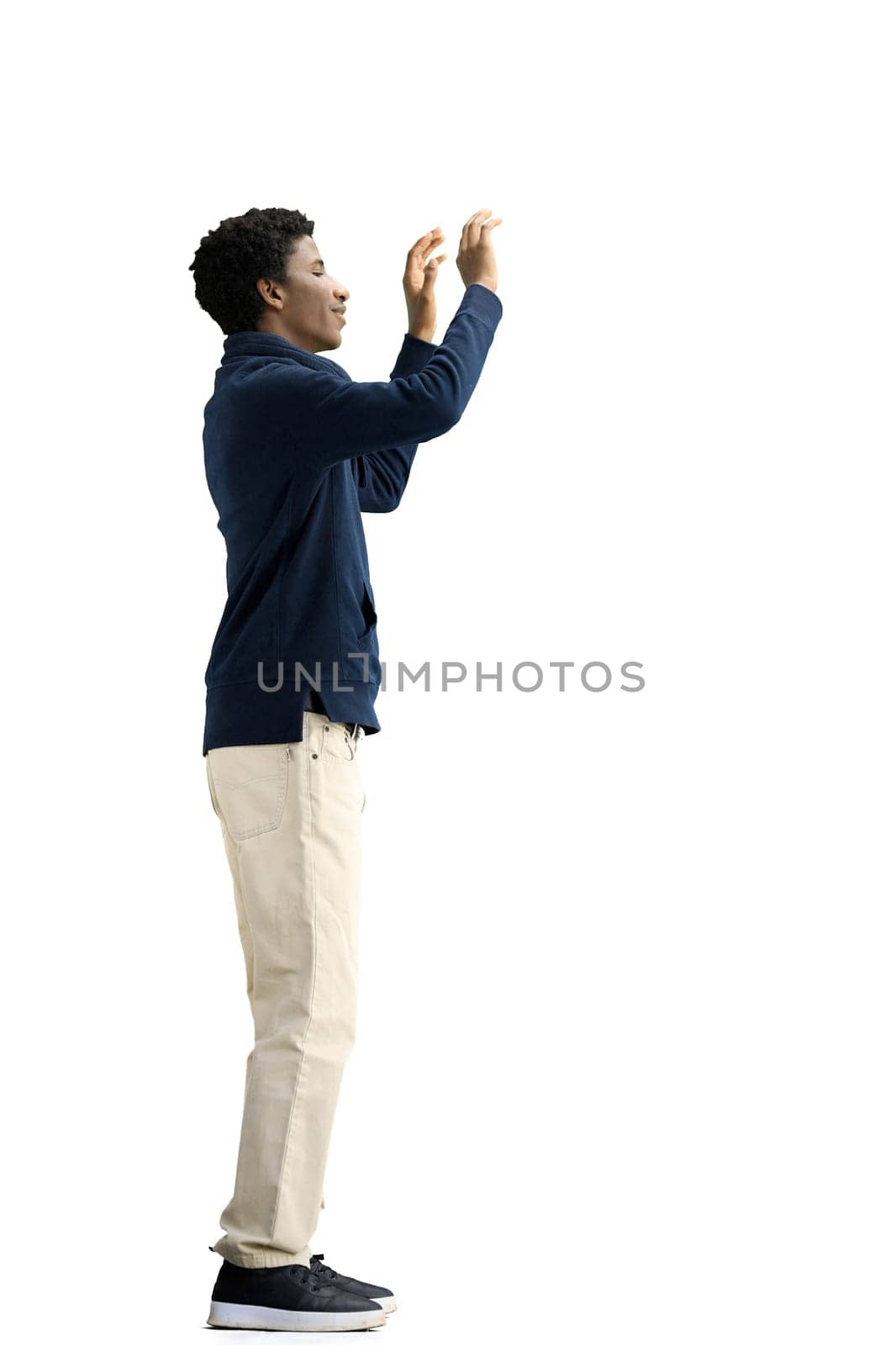 A man, full-length, on a white background, waving his arms.