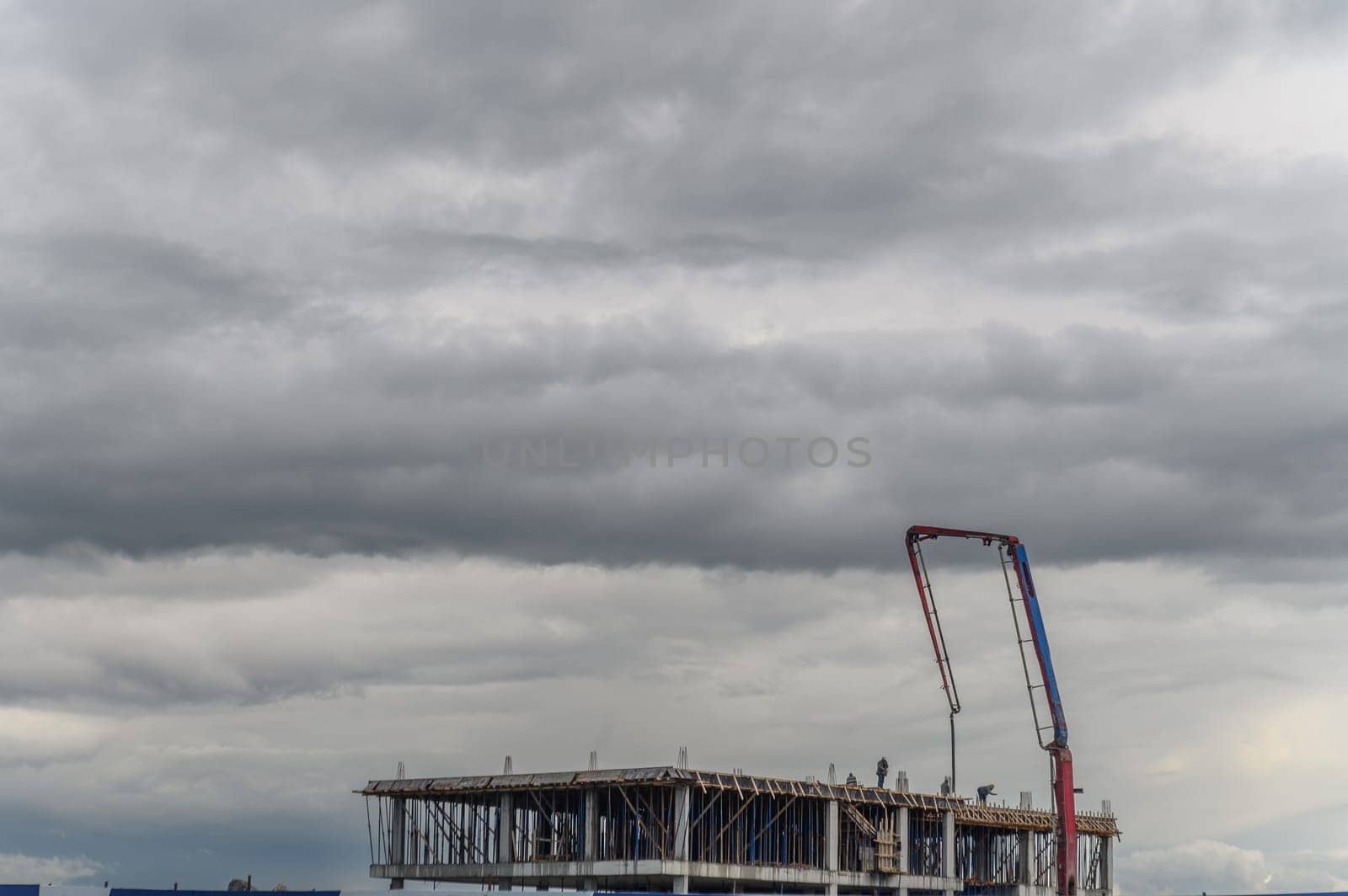 machine for pouring concrete at a construction site on a winter day in Cyprus 4