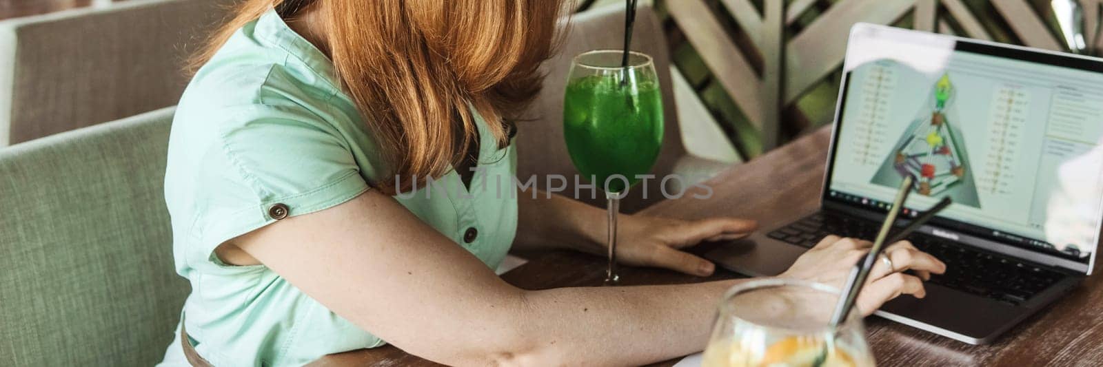 Tver, Russia-august 7, 2022. A woman with a laptop is studying human design. The concept of studying esoteric sciences. Studying rave postcards from human design by Annu1tochka