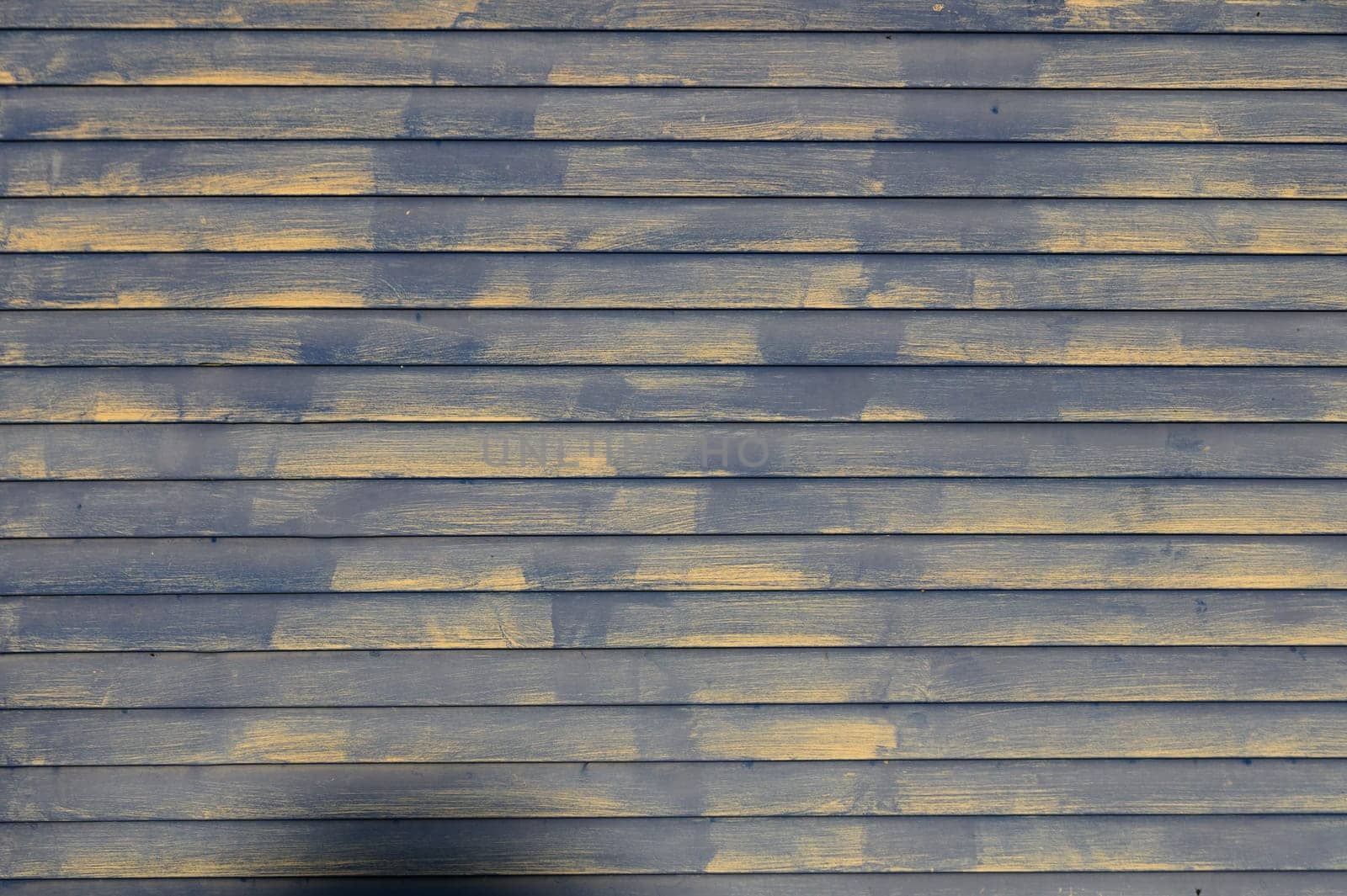 old painted boards as a background in the sun