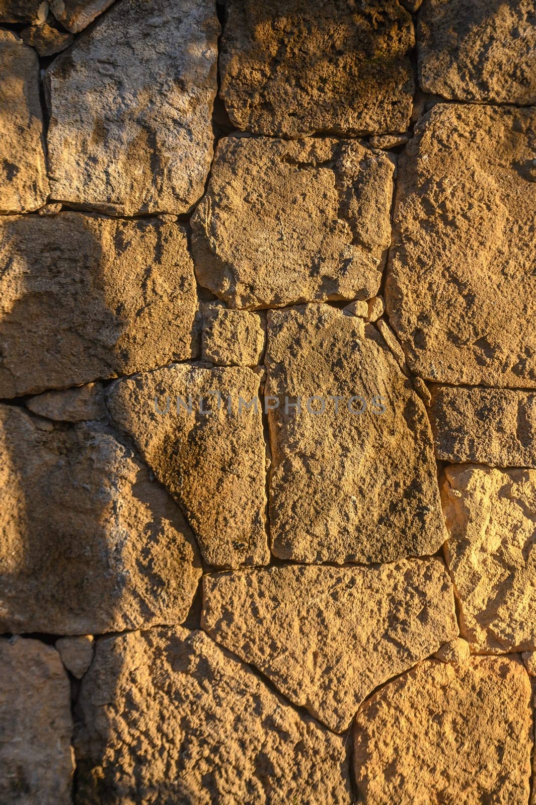 wall made of real stone as a background in the sun 4 by Mixa74