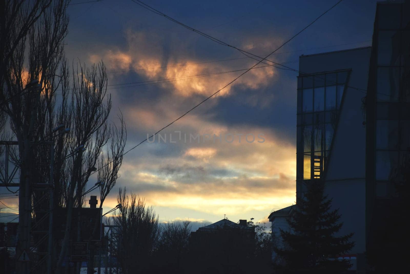 Panoramic skyline and modern commercial buildings with empty road. Asphalt road and cityscape at sunrise