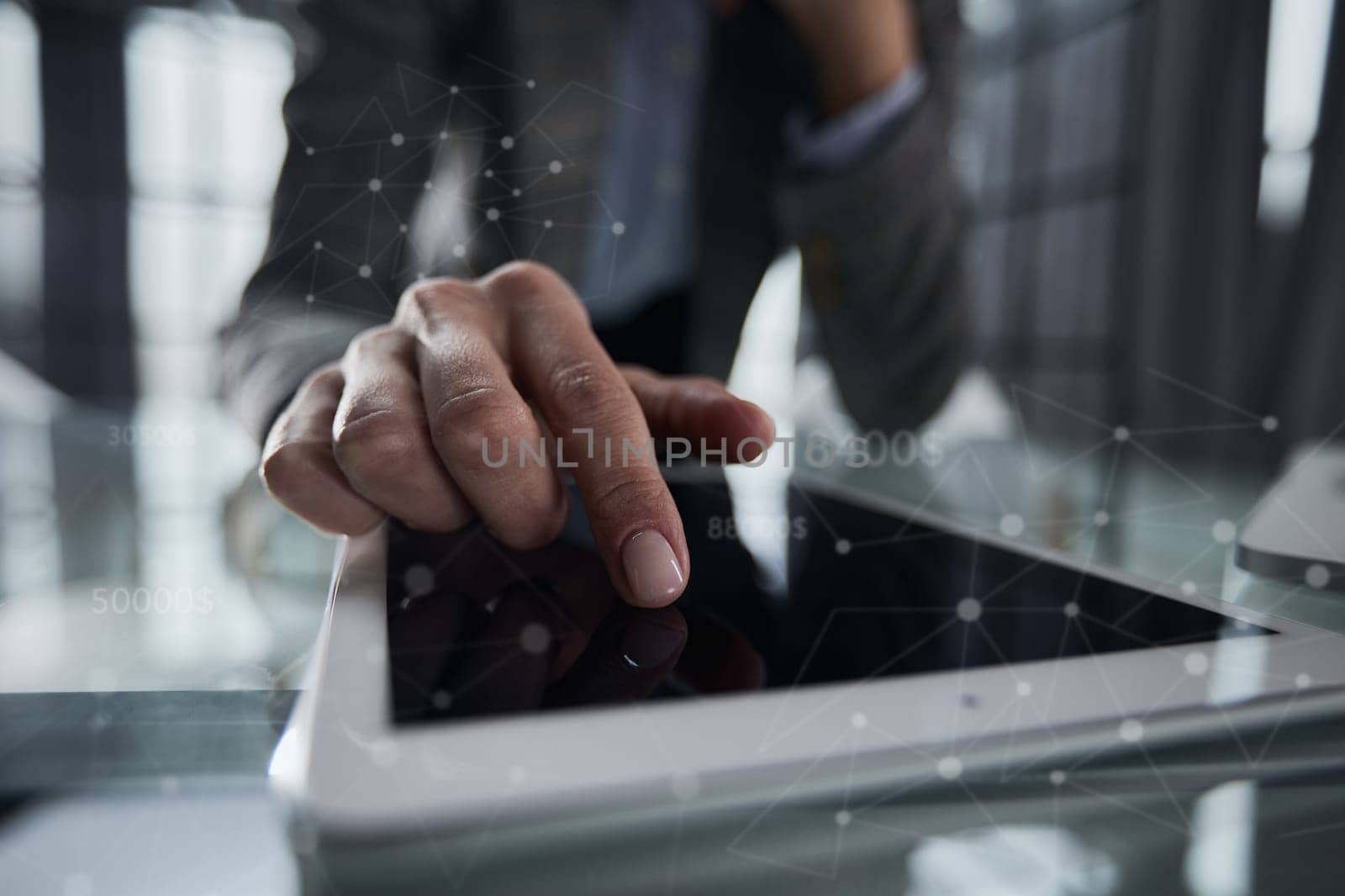 businessman pressing his finger on the screen of the digital tab by Prosto