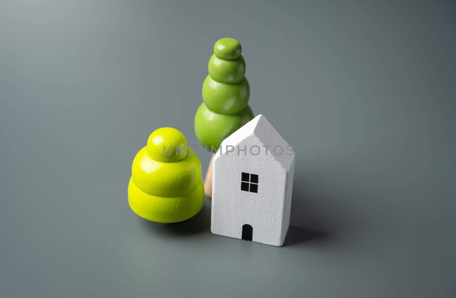 House and decorative trees, figurines. Housing prices. Buying and selling real estate. by iLixe48